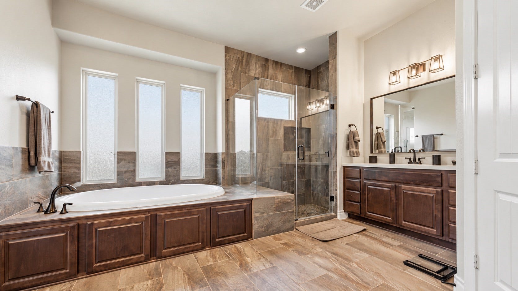 Spacious bathroom with extended vanity, large mirror and abundant storage.