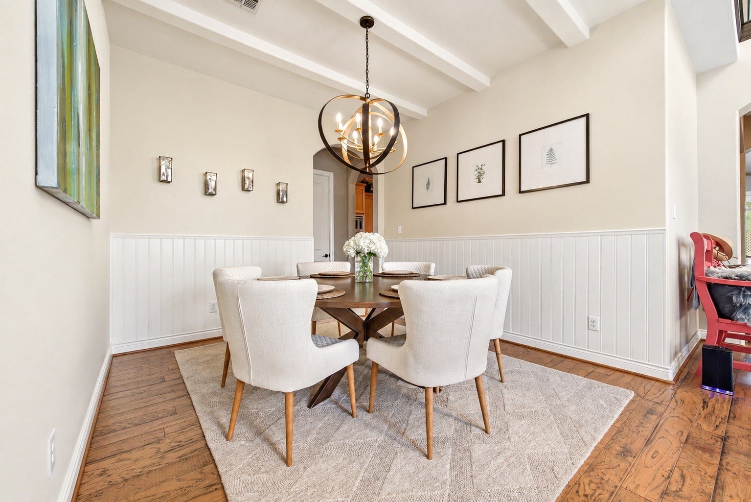 Dining room showcasing the spacious layout, wainscoting and updated neutral finishes. AI-generated image depicting a potential wall paint color.AI-generated image depicting a potential wall paint color.