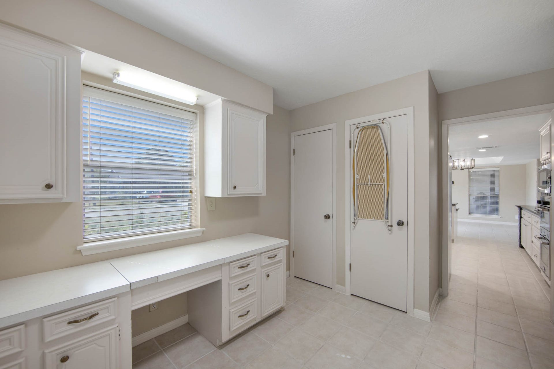 Large workspace in the laundry room that can be used for another office