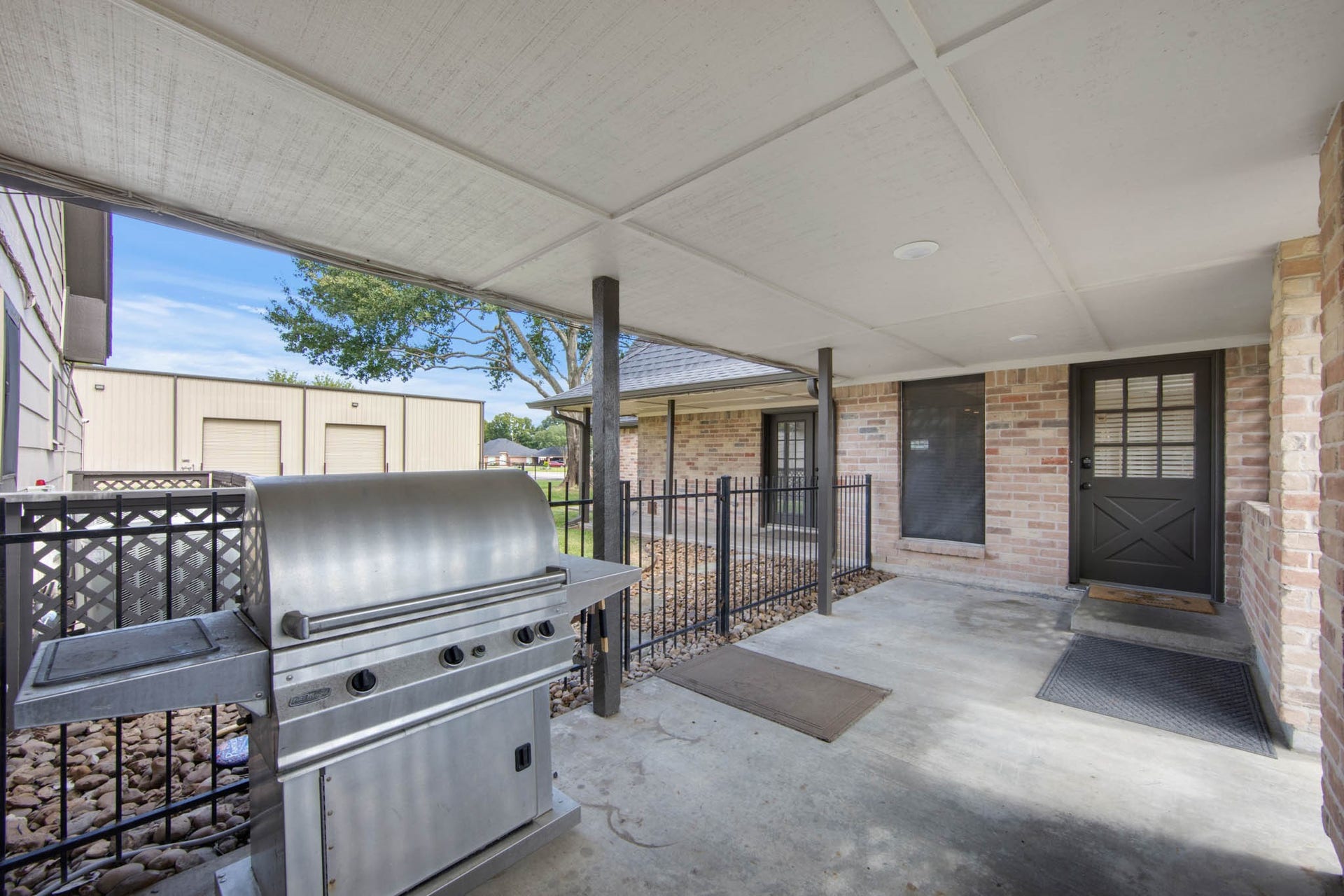 Covered breezway leading to the garage
