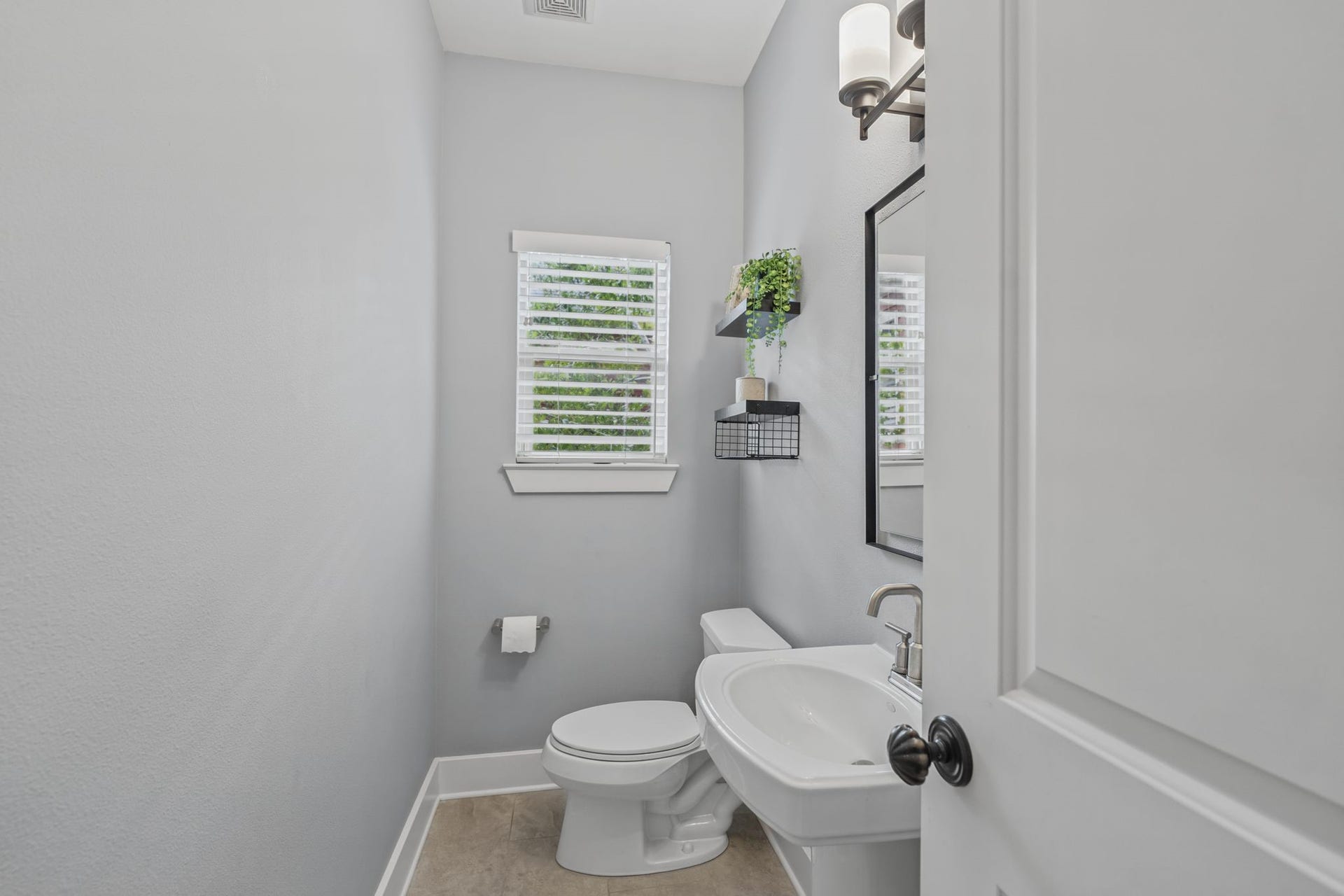 1517 Blair Street, Houston, TX 77008 A half bathroom is located on second-floor for guest use.