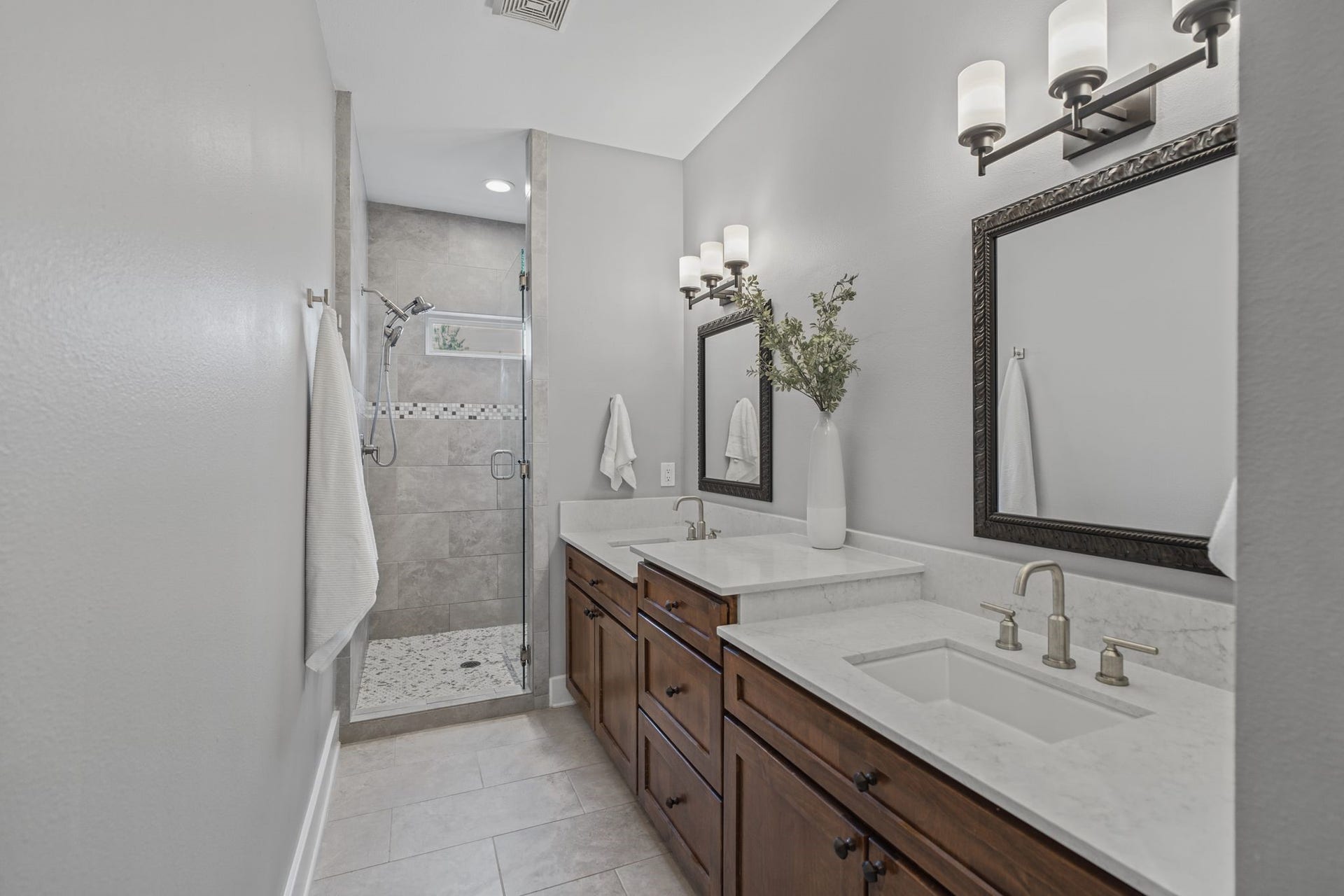 1517 Blair Street, Houston, TX 77008 Light countertops complement warm wood cabinetry, offering a clean, inviting look with ample storage.