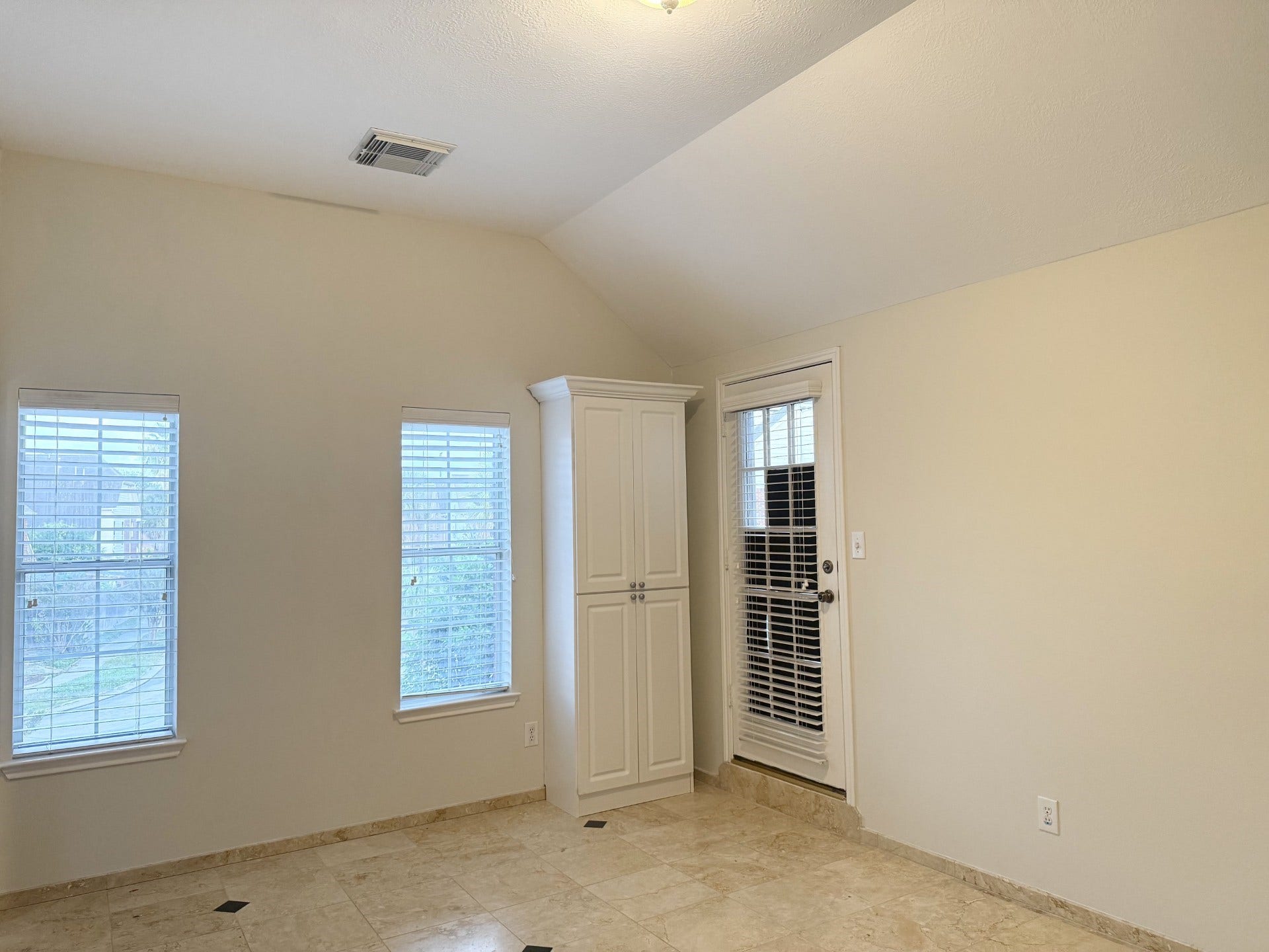 Primary bedroom, built in cabinates, Tile flooring, high ceiling  with great size balcony to relax and enjoy your morning coffee.