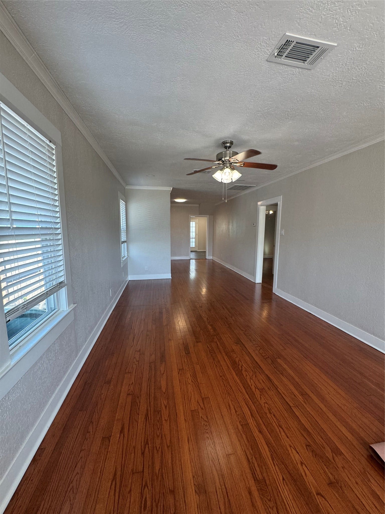 5208 Bernardo de Galvez, Galveston, TX 77551 Living room with original wood floors. Gorgeous!