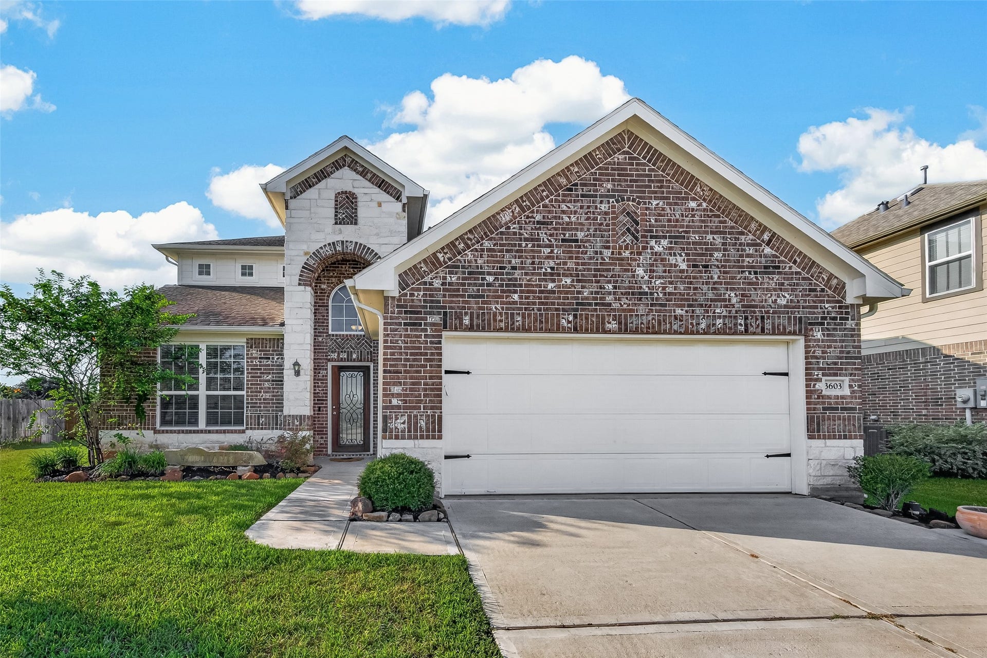 3603 Gentle Meadow Drive, Richmond, TX 77406 Beautiful brick and stone elevation with designer landscape for charming curb appeal