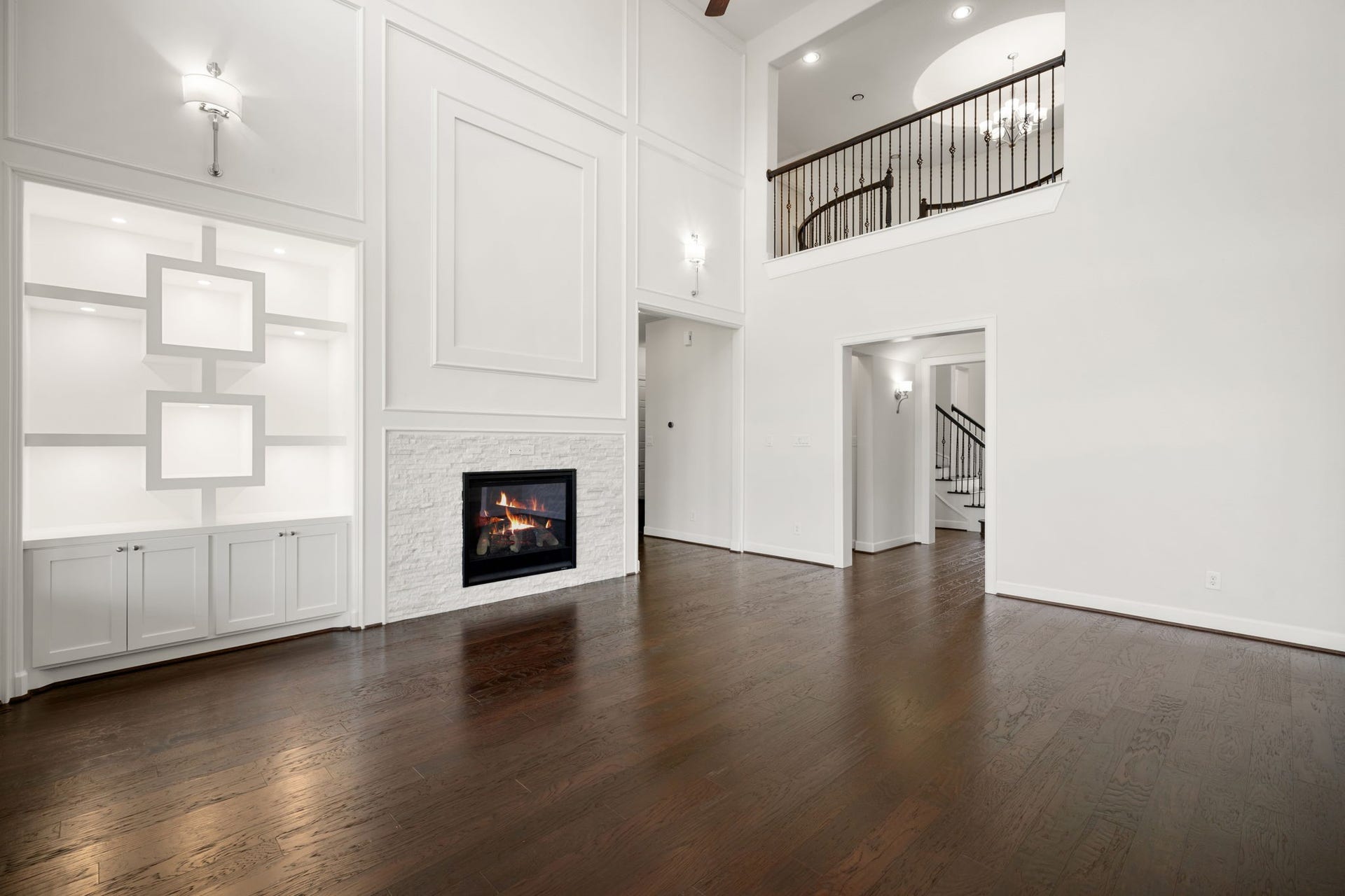 3622 Sage Hollow Drive, Spring, TX 77386 The family room's symmetrically extended walls feature geometric open-box built-in cabinetry with integrated accent lighting, custom flat trim, and upgraded 5-1/4" baseboards.