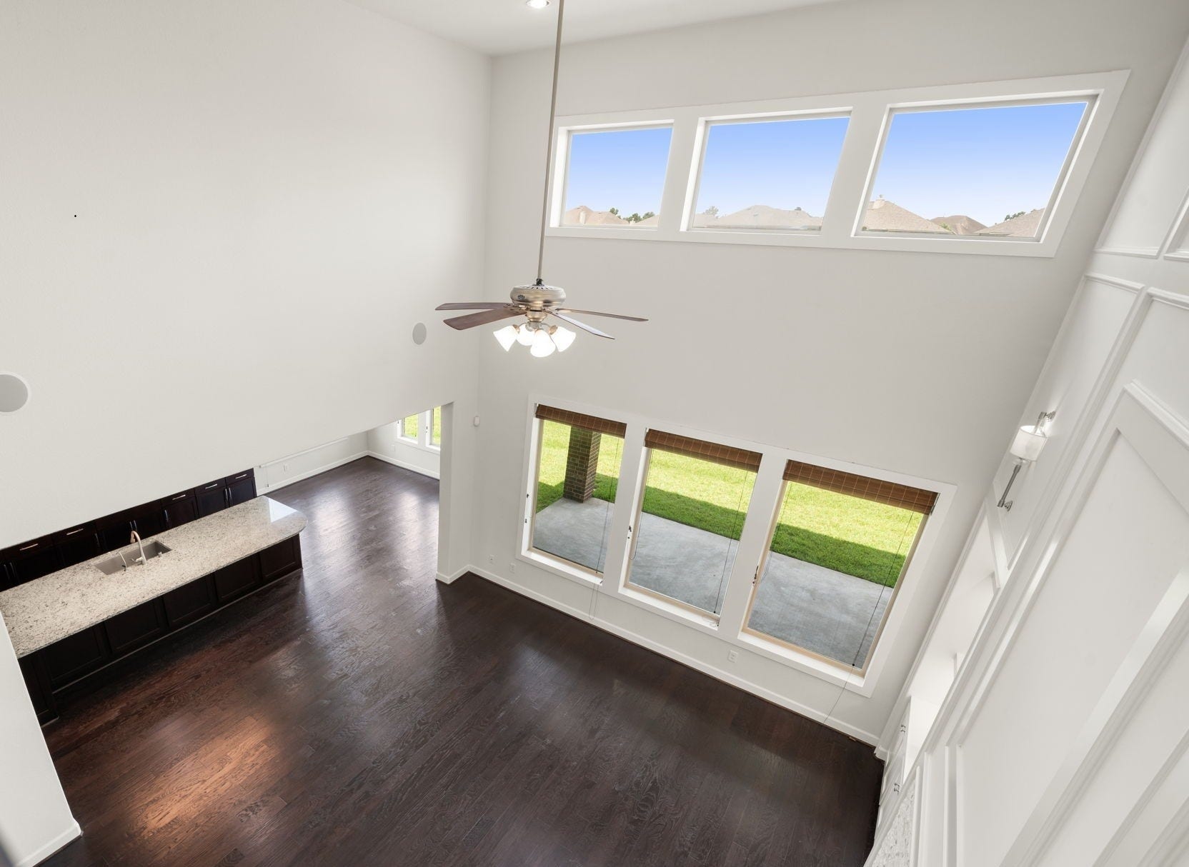 3622 Sage Hollow Drive, Spring, TX 77386 This bird's-eye view from the upper-level overlook showcases the vastness of the open-concept footprint, highlighting the kitchen island and breakfast bar from above.