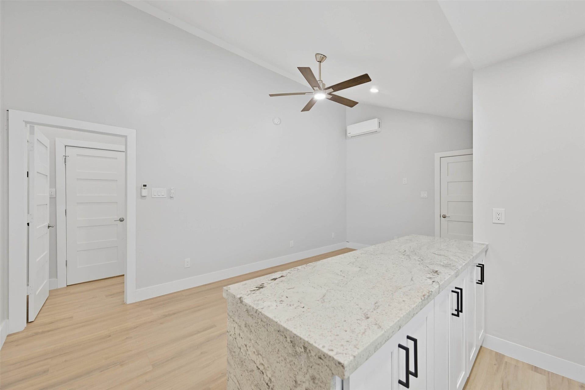 10930 White Thorn Street, #B, Houston, TX 77016 The waterfall island with quartz countertop adds a touch of elegance while providing a functional seating area and extra storage space for all your culinary needs.