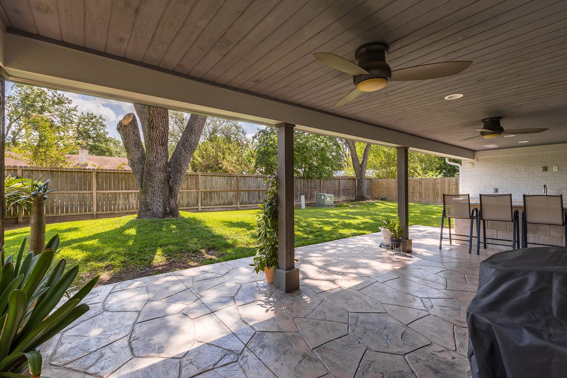 906 Eva Drive, Katy, TX 77493 Fans, custom woodwork, french drains, stamped concrete and more!