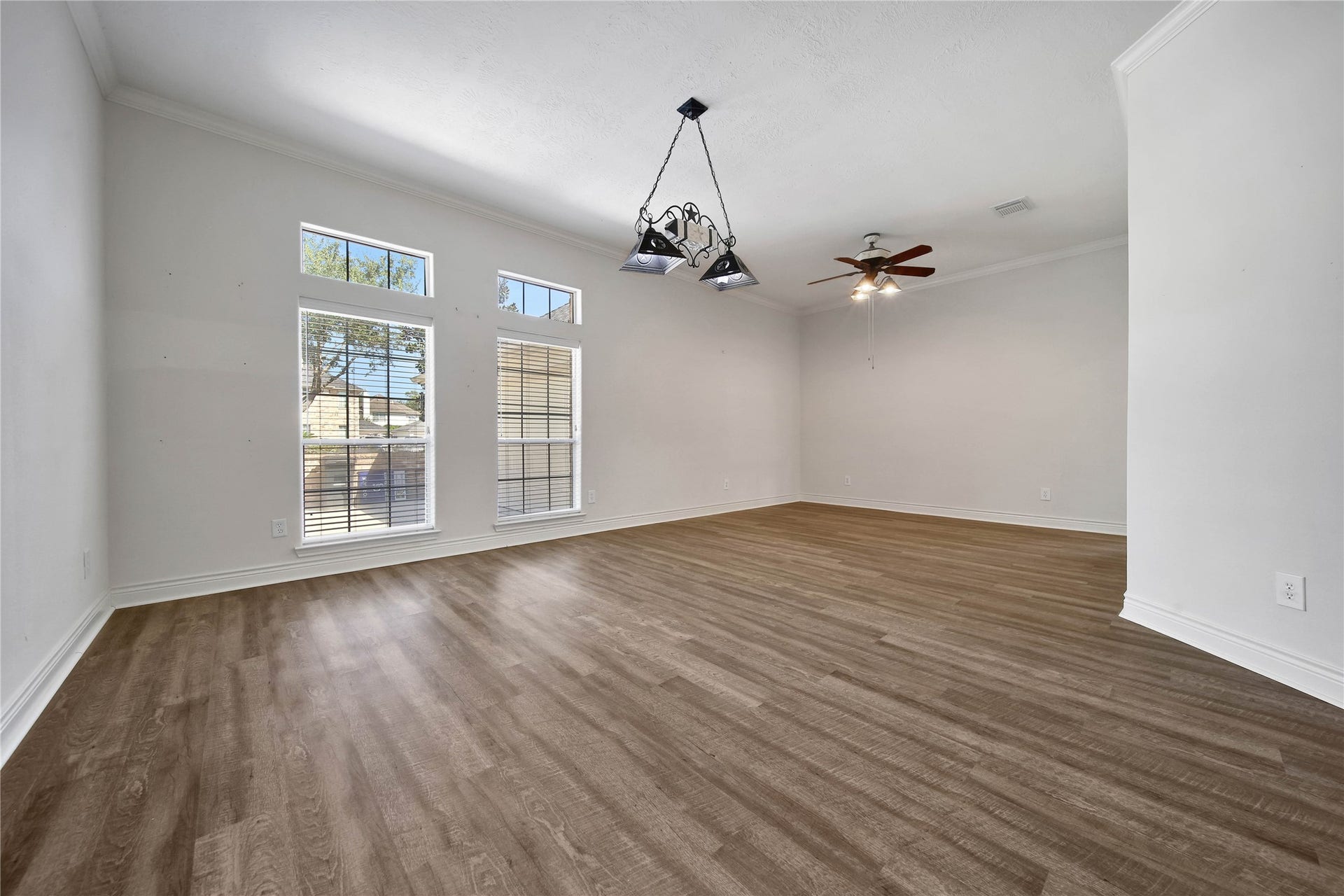 5918 Greenway Manor Lane, Spring, TX 77373 Spacious formal dining room just oof the entry, featuring tall windows that fill the space with natural light. An inviting setting for gatherings and entertaining.