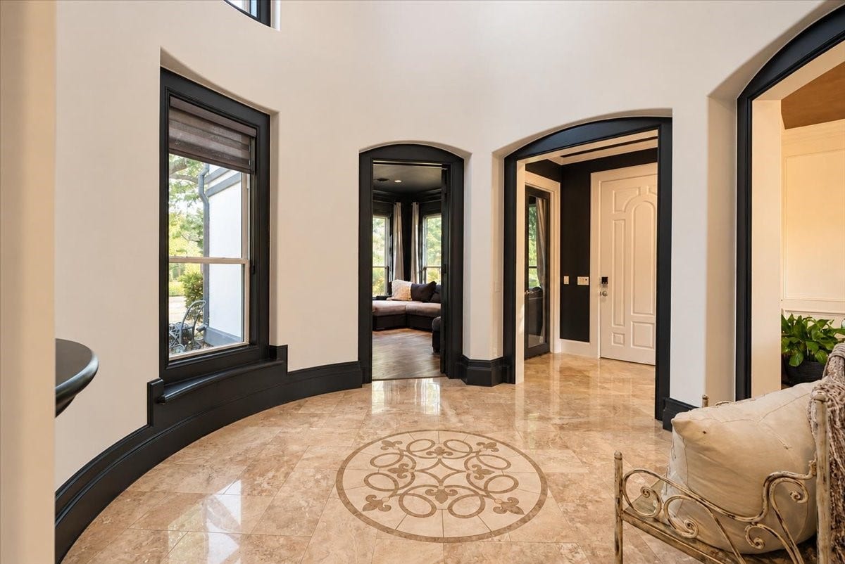 8514 Haven Way, Tomball, TX 77375 Arched openings from the rotunda foyer lead to the media room and the formal dining room, creating an easy flow for movie nights and holiday gatherings.