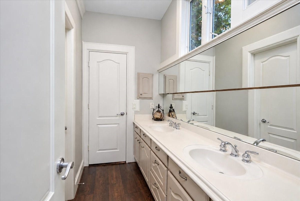 8514 Haven Way, Tomball, TX 77375 Shared bath made for easy mornings, featuring dual sinks, generous counter space, and natural light from the windows above the mirror.