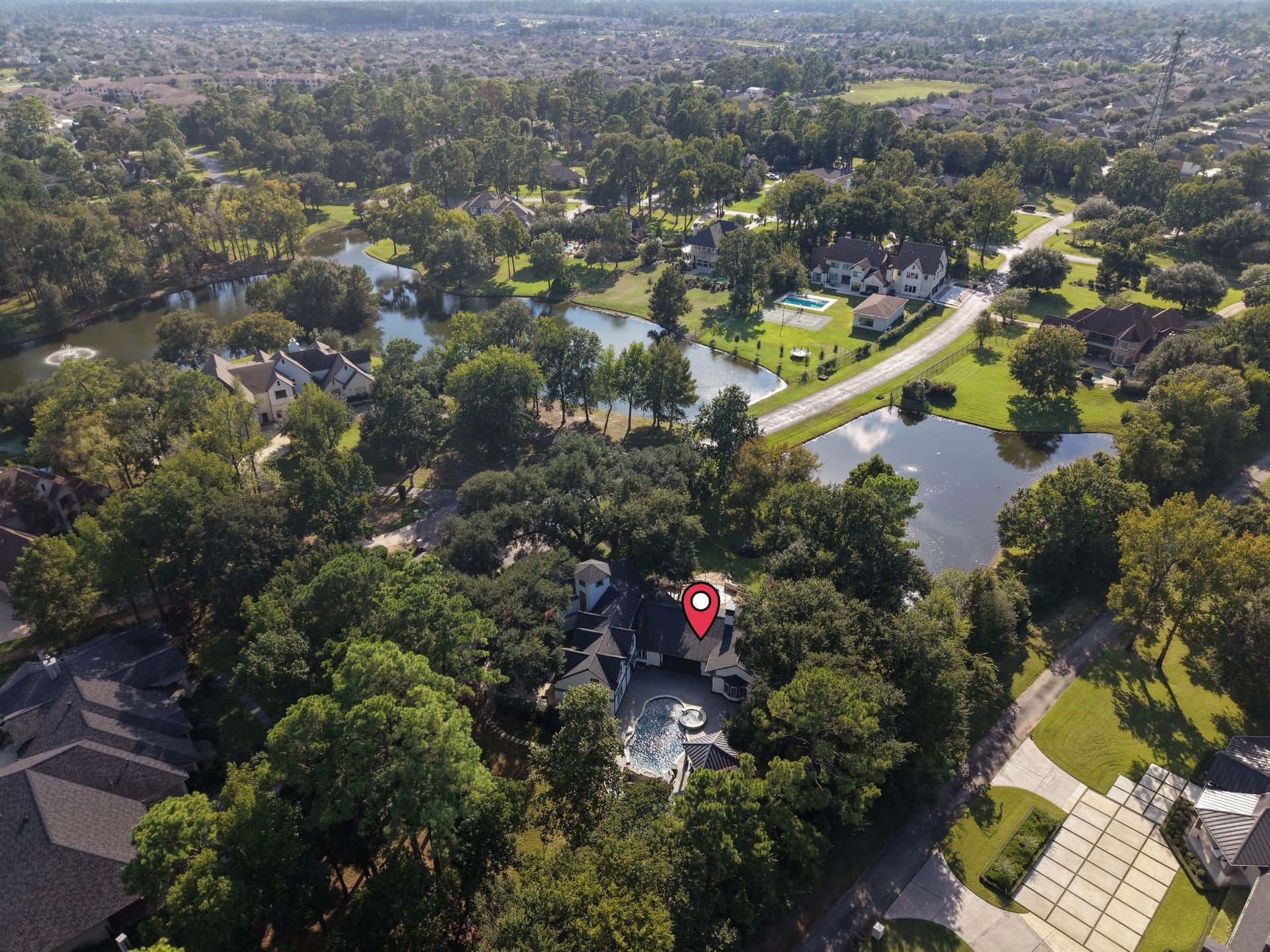 8514 Haven Way, Tomball, TX 77375 Tucked among mature trees in Haven Lake Estates, a quiet community of just 28 homes, this 1.19-acre property offers privacy and peaceful living, with beautiful views and ponds nearby.