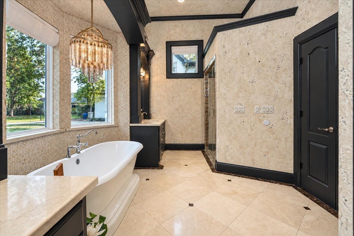 8514 Haven Way, Tomball, TX 77375 Another look at the primary bath, featuring a newly redone walk-in shower with a glass enclosure.