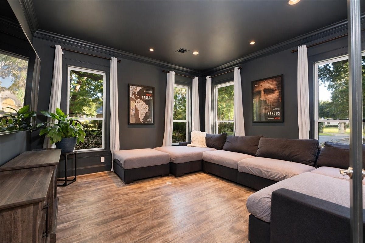 8514 Haven Way, Tomball, TX 77375 Right off the foyer, this media room is ready for your familys favorite shows and gatherings. Recessed lighting, crown molding, and wide windows make it a bright, comfortable retreat.