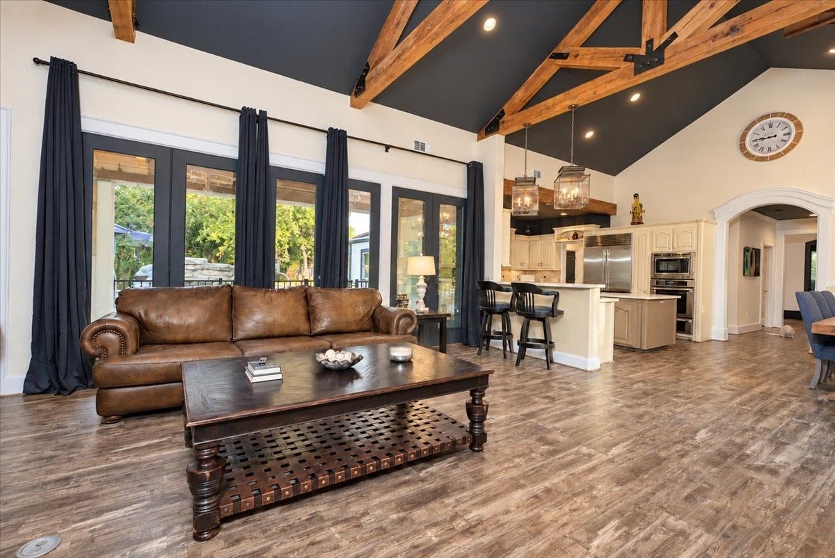8514 Haven Way, Tomball, TX 77375 Open to the kitchen and filled with natural light, this living room is made for gatherings.