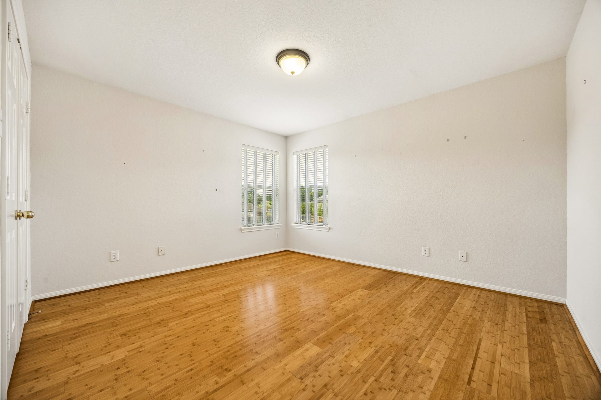 2843 Five Oaks Drive, Missouri City, TX 77459 With three very spacious guest bedrooms, youll always have room for company. This inviting bedroom offers a fresh neutral color palette, bamboo flooring, a large closet and a full bathroom nearby, making it a comfortable retreat for family and overnight guests.
