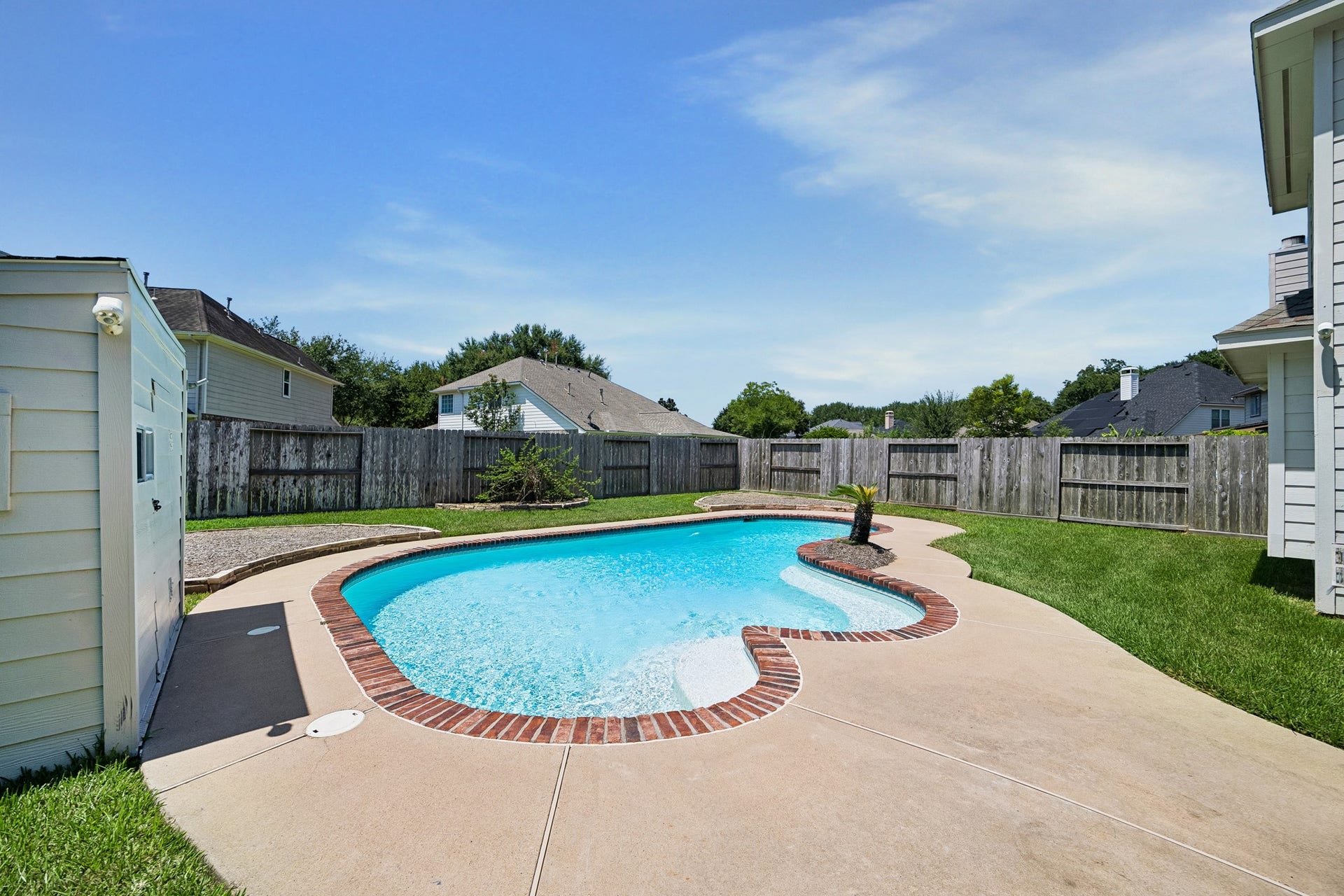 2843 Five Oaks Drive, Missouri City, TX 77459 The backyard feels like its own private escape with a spacious inground pool just steps from the house, making it easy to move from indoor living to sunny afternoons and poolside fun.