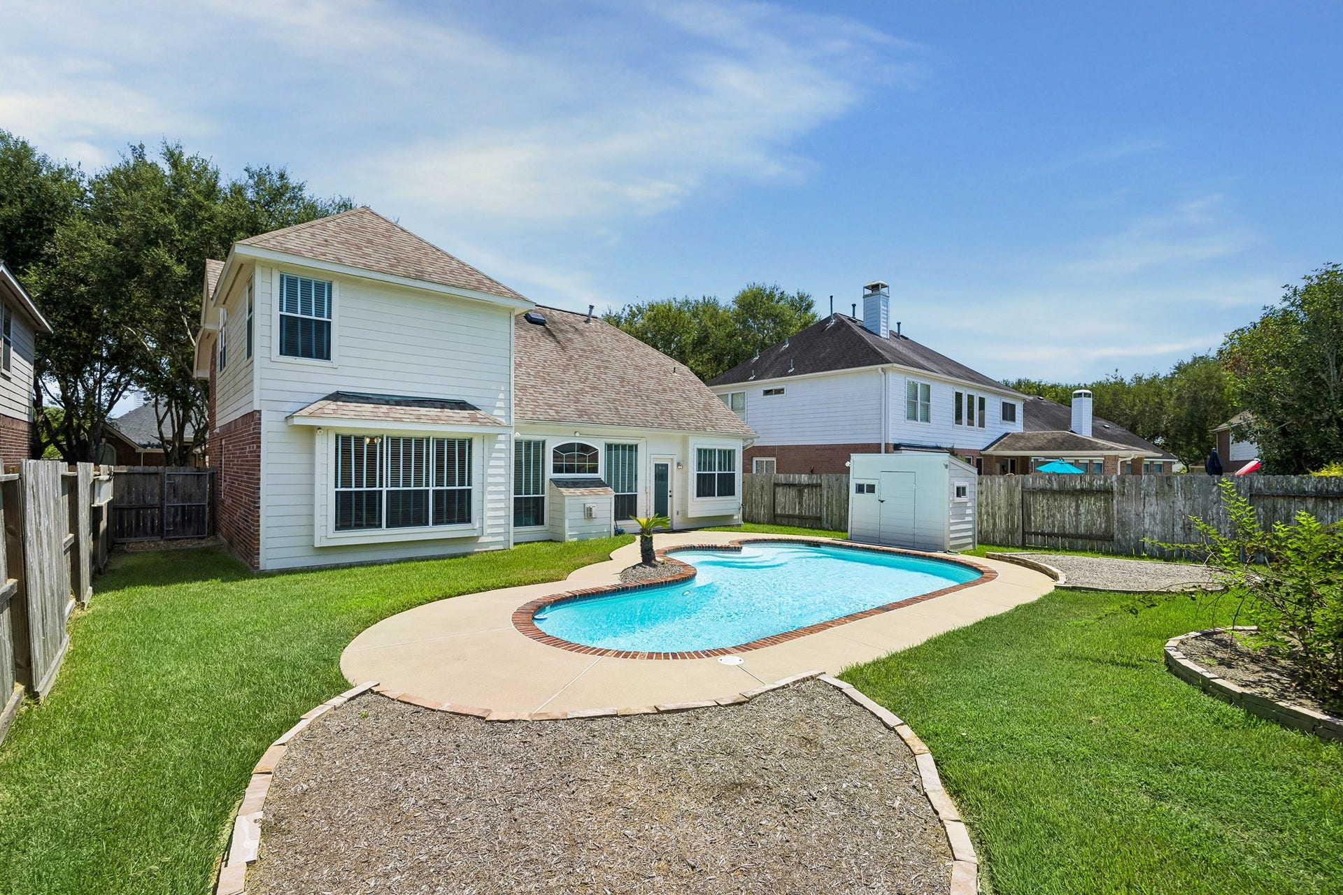 2843 Five Oaks Drive, Missouri City, TX 77459 Summer days were made for this backyard, where an oversized pool ranges from 3 to 8 feet deep and still leaves plenty of grassy space for yard games, play and pets. A thornless blackberry bush adds a sweet touch, producing handfuls of fresh blackberries each early summer.