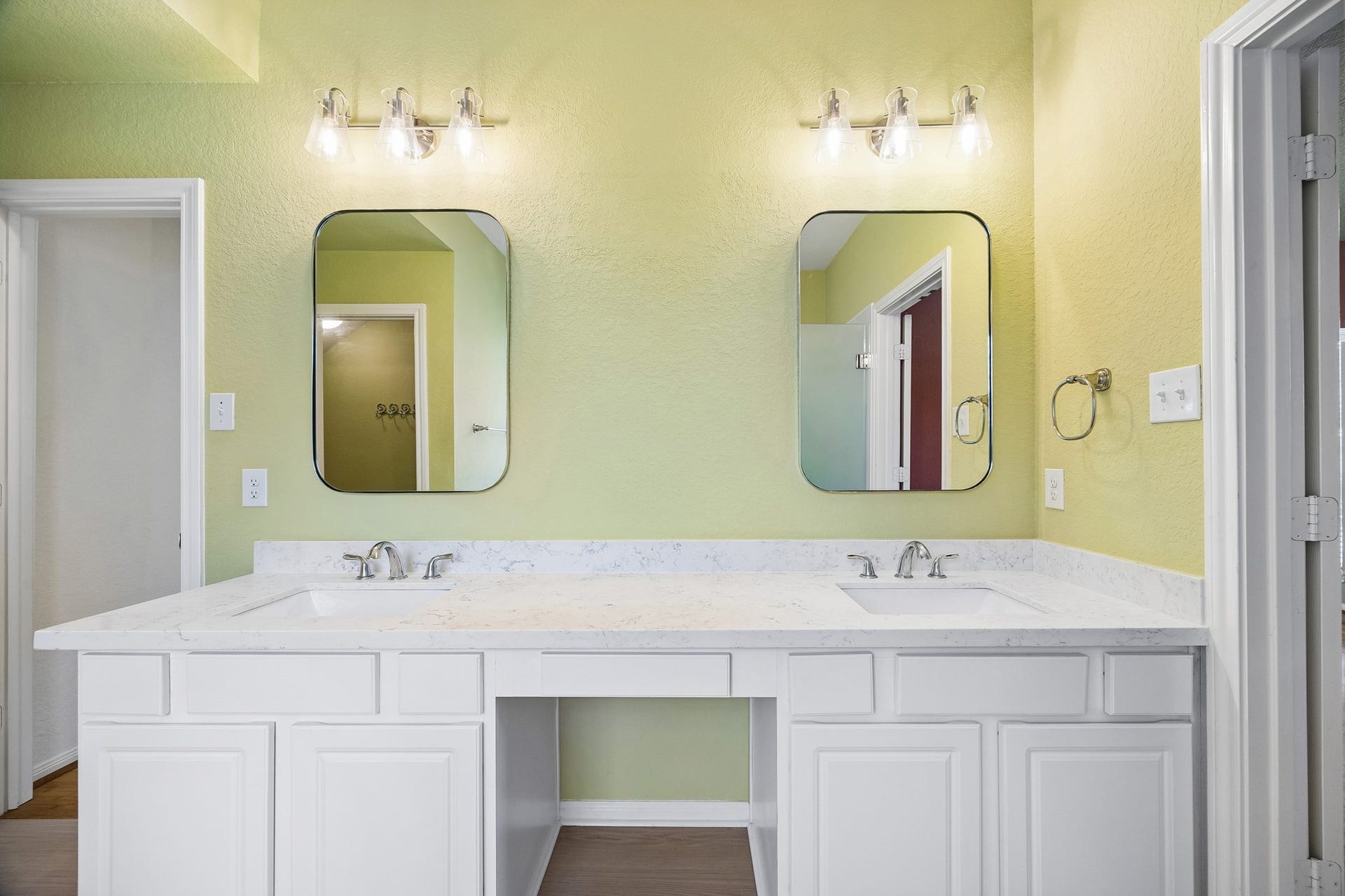 2843 Five Oaks Drive, Missouri City, TX 77459 The updated vanity in the primary ensuite brings style and function together with sleek under mount sinks, framed mirrors, stylish lighting and plenty of counter space and storage.