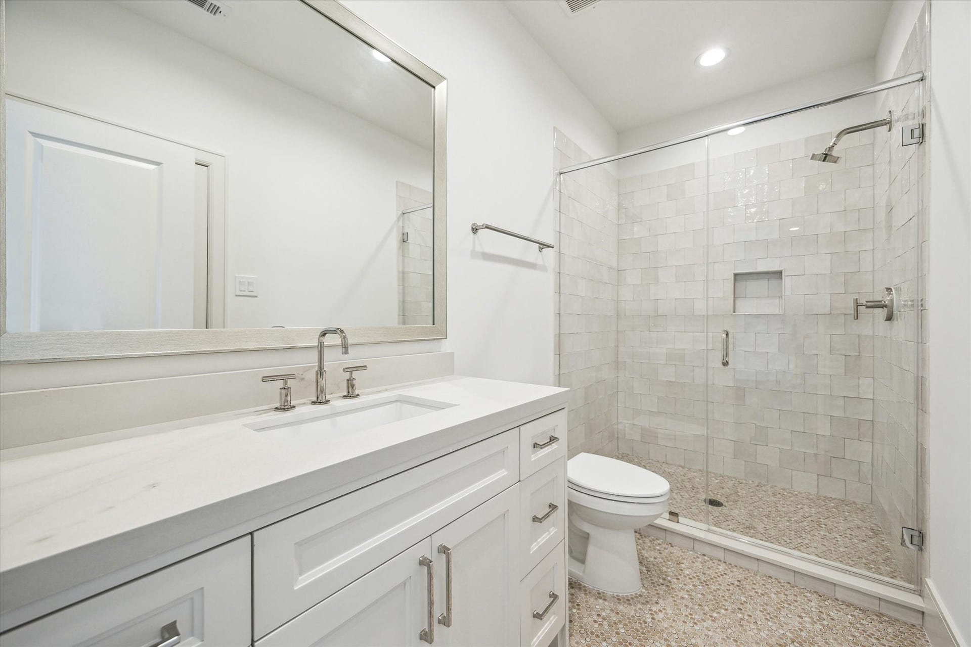 209 Sutton Row Place, Houston, TX 77024 Full bath accessible to game room and secondary bedroom, with glass enclosed shower.
