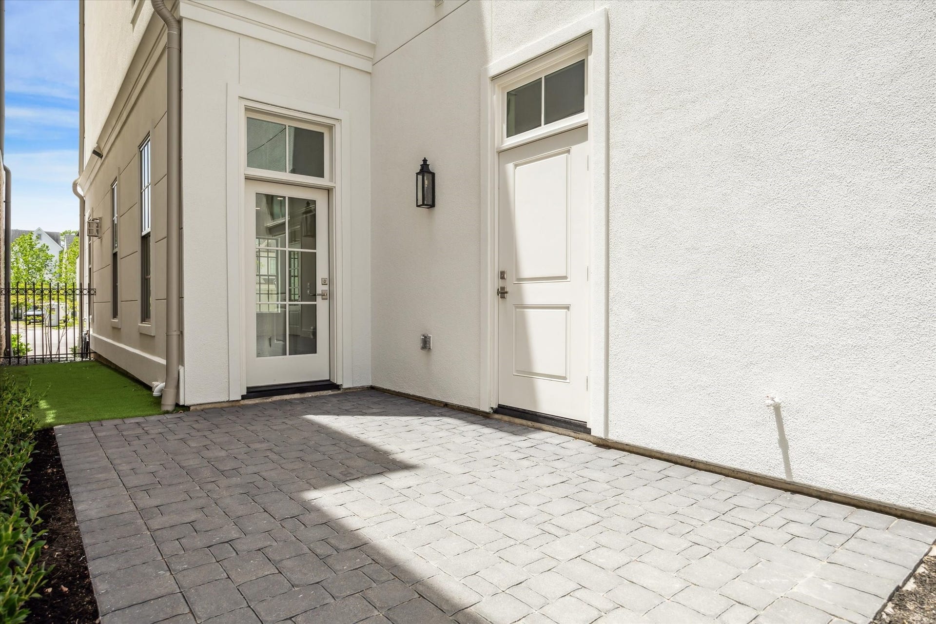 209 Sutton Row Place, Houston, TX 77024 Private courtyard features patio and artificial turf, accessible from glass door in house, side door to garage and back gate from curb.