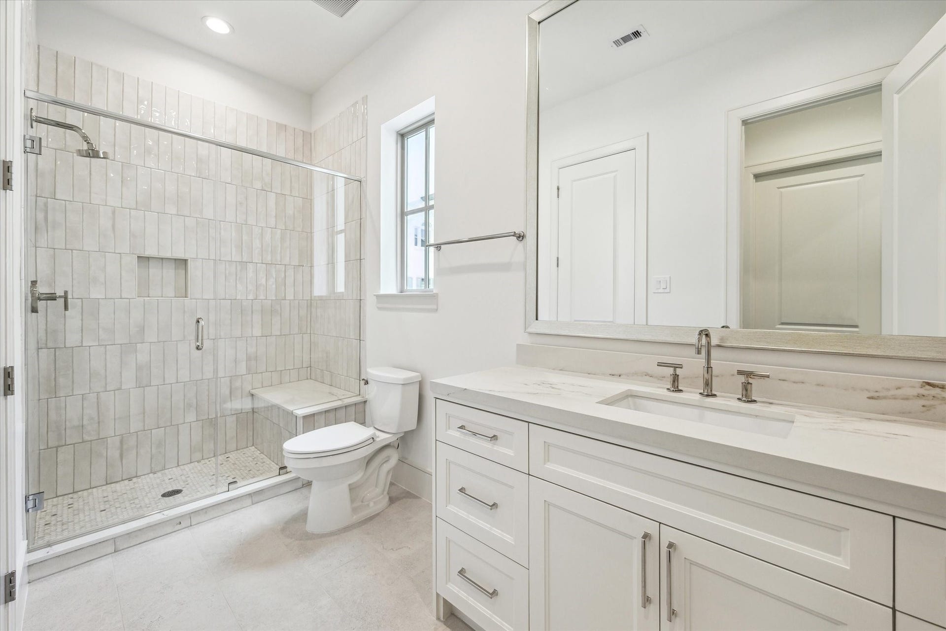 209 Sutton Row Place, Houston, TX 77024 Full bath off secondary features glass enclosed shower with seat.