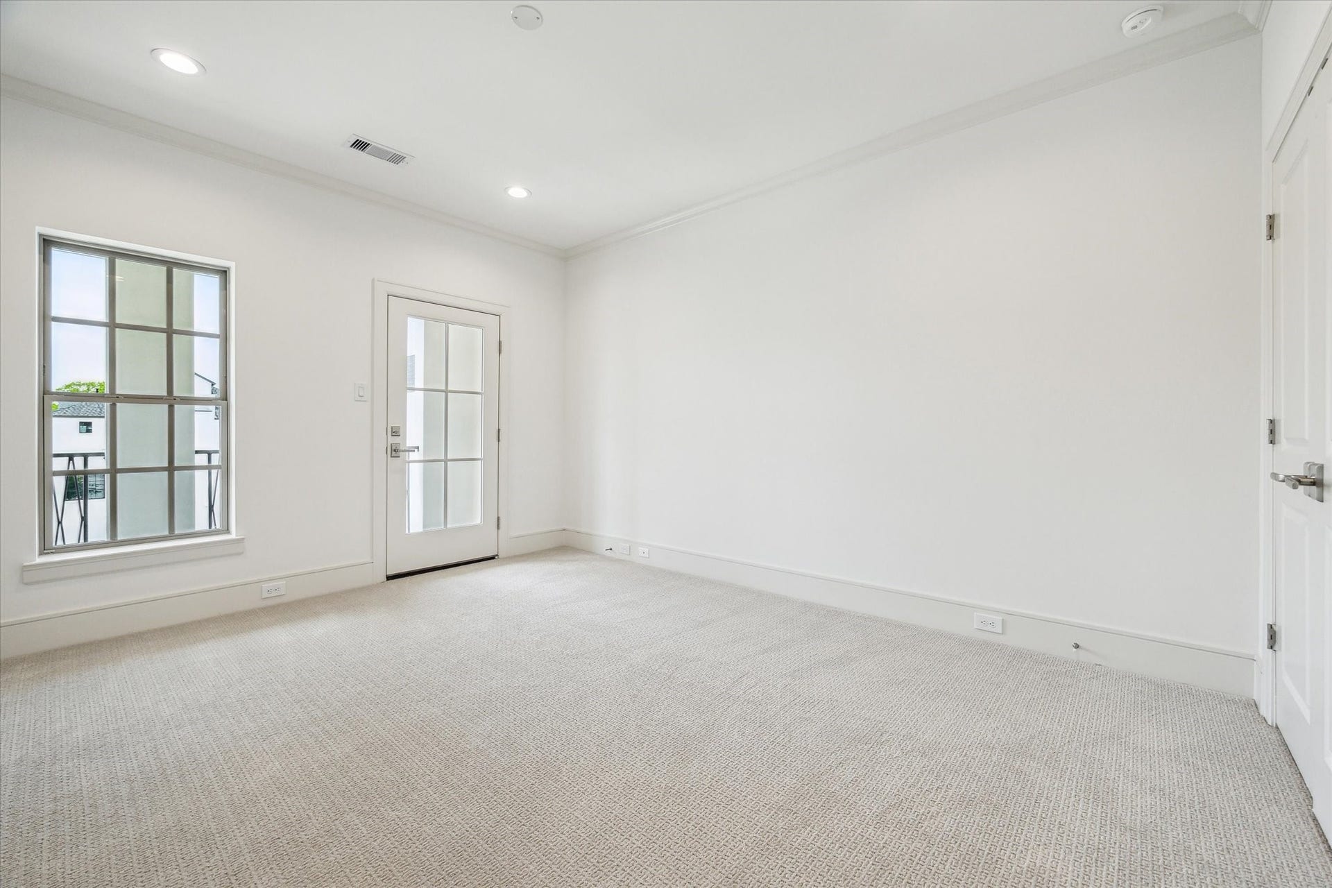 209 Sutton Row Place, Houston, TX 77024 Third-floor Secondary Bedroom with walk-in closet, and glass door for access to balcony.