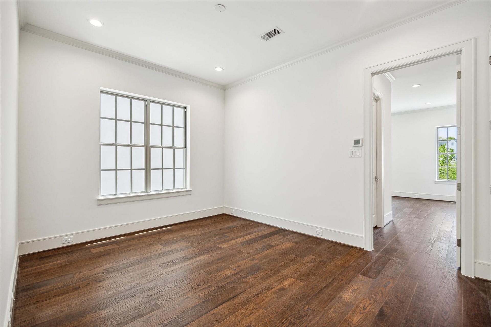 209 Sutton Row Place, Houston, TX 77024 Sitting room off second floor stairwell landing, access to primary bedroom on right and utility room and secondary bedroom/bath on left.