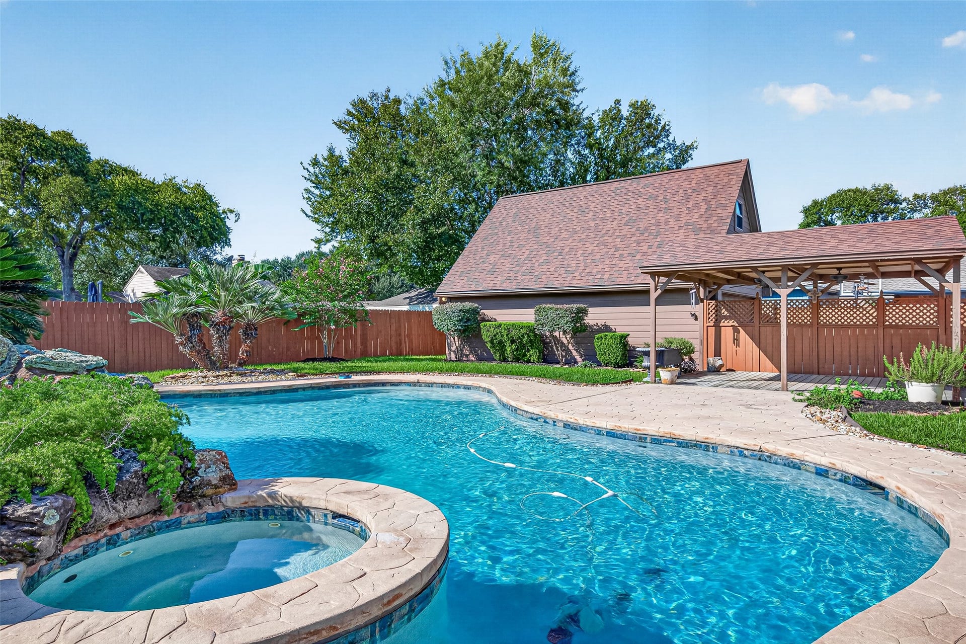 MAKE A SPLASH IN YOUR OWN BACKYARD! Enjoy a refreshing swim on a warm Texas afternoon or relax in the heated spa after a long day! This beautiful in-ground gunite swimming pool features a chlorine system, curved design & generous surrounding decking for lounging poolside. Both the pool & spa are heated, extending the opportunities to enjoy your backyard retreat beyond the summer months. And there's still plenty of grassy yard space for outdoor games, pets & playtime!
