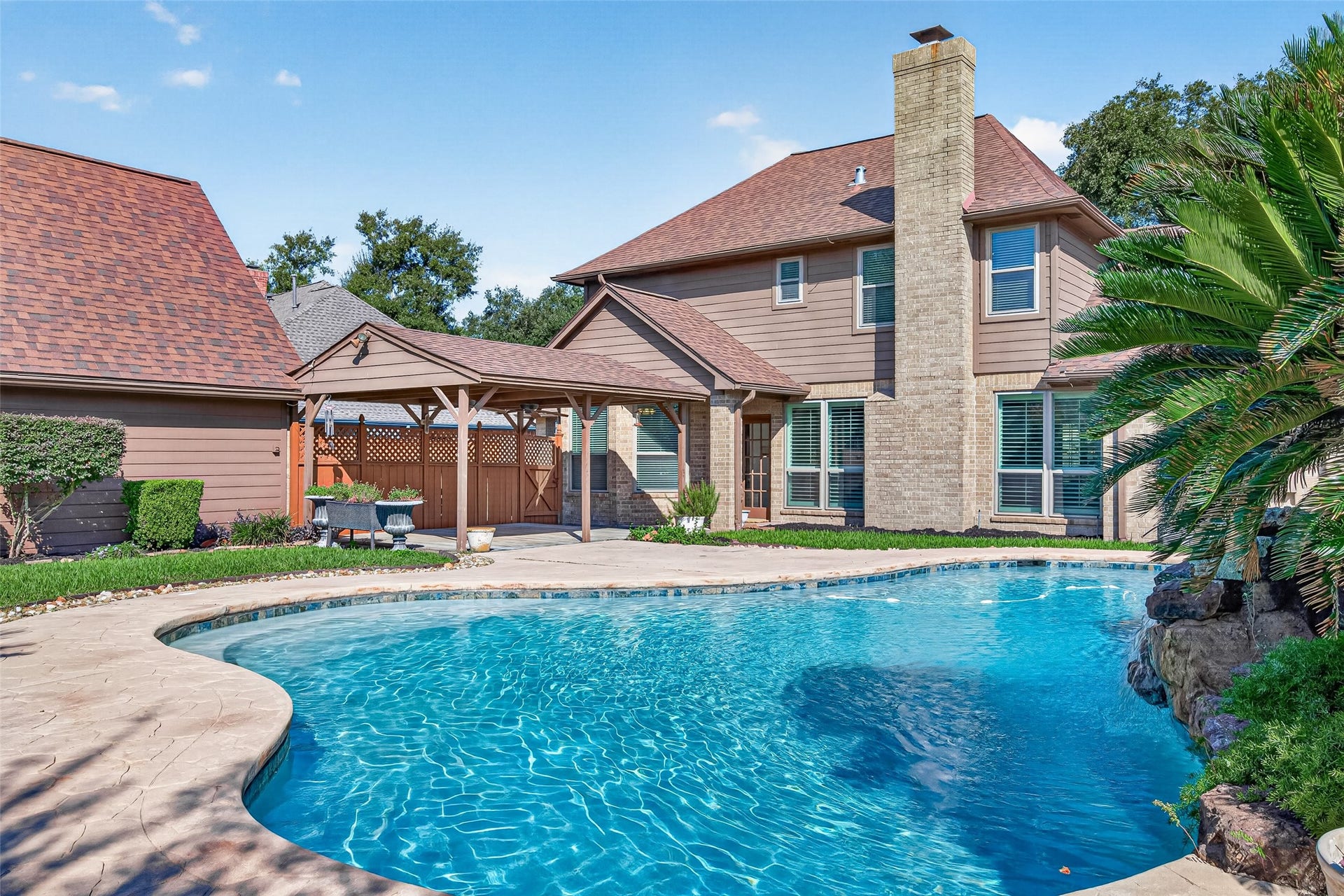 YOUR BACKYARD ENTERTAINING DESTINATION! Imagine summer afternoons spent poolside, weekend cookouts with friends & evenings relaxing outdoors! This backyard offers a wonderful setting for entertaining, with a beautiful swimming pool, heated spa, & a covered outdoor gathering area. There's plenty of grass for the family dog to run & play, plus room to host a celebration or simply enjoy a quiet afternoon at home. The home's attractive combination of brick & Hardie board siding adds to its traditional charm.