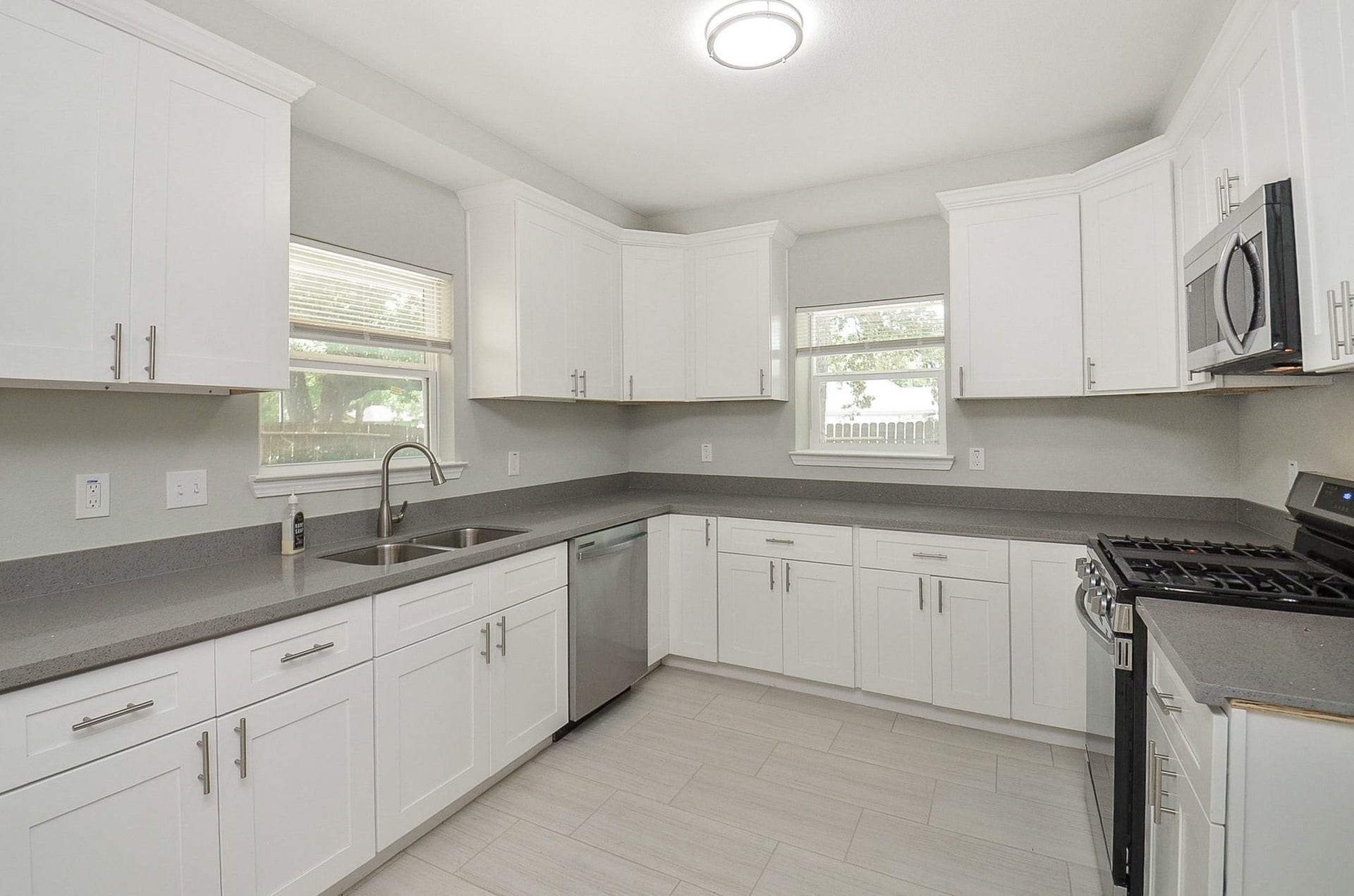 29502 Stapleford Street, Spring, TX 77386 The crisp, white cabinetry offers ample storage space and the spacious counter tops allow meal preparation to be easy and convenient.