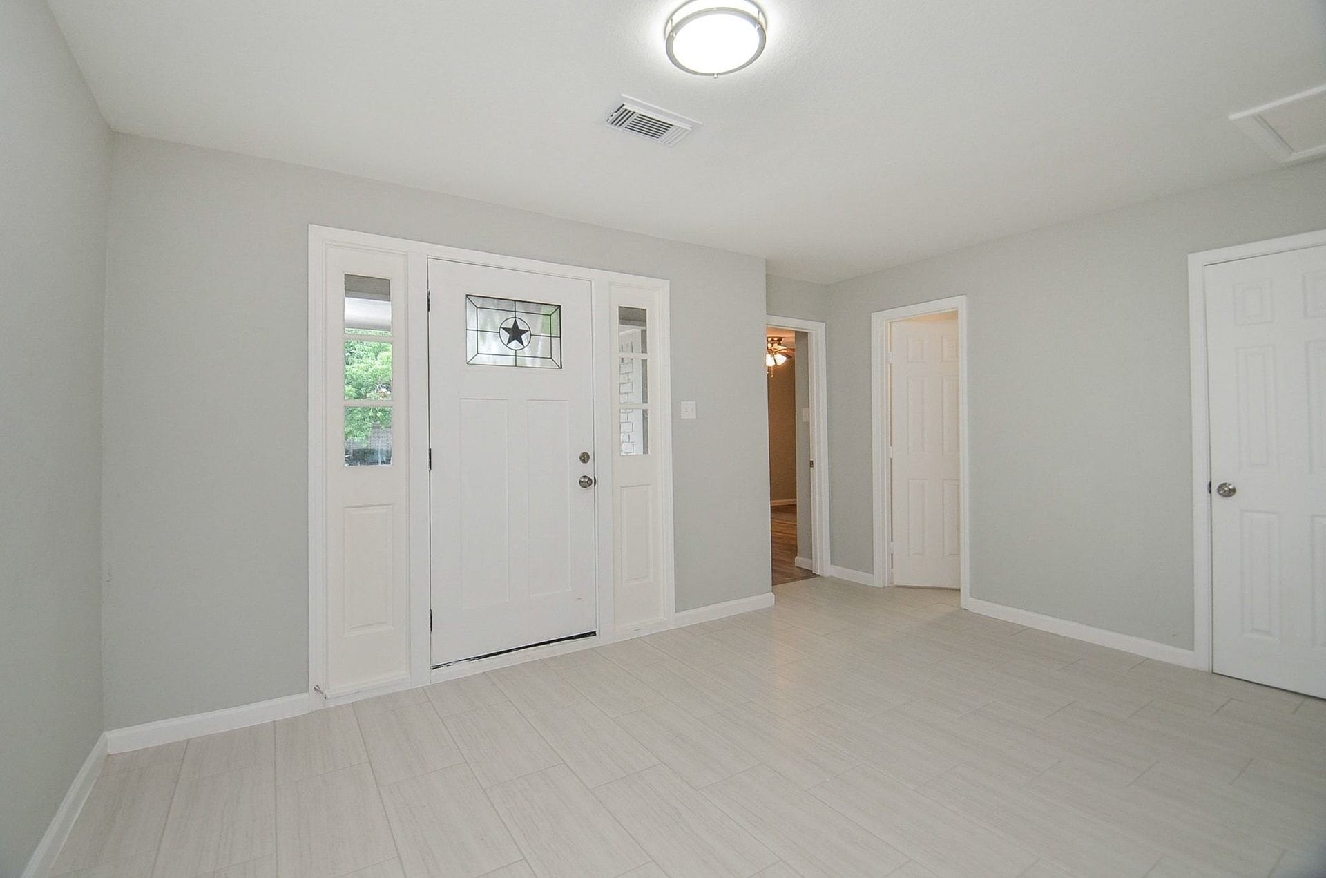 29502 Stapleford Street, Spring, TX 77386 This well lit entryway gives a modern touch to the home.
