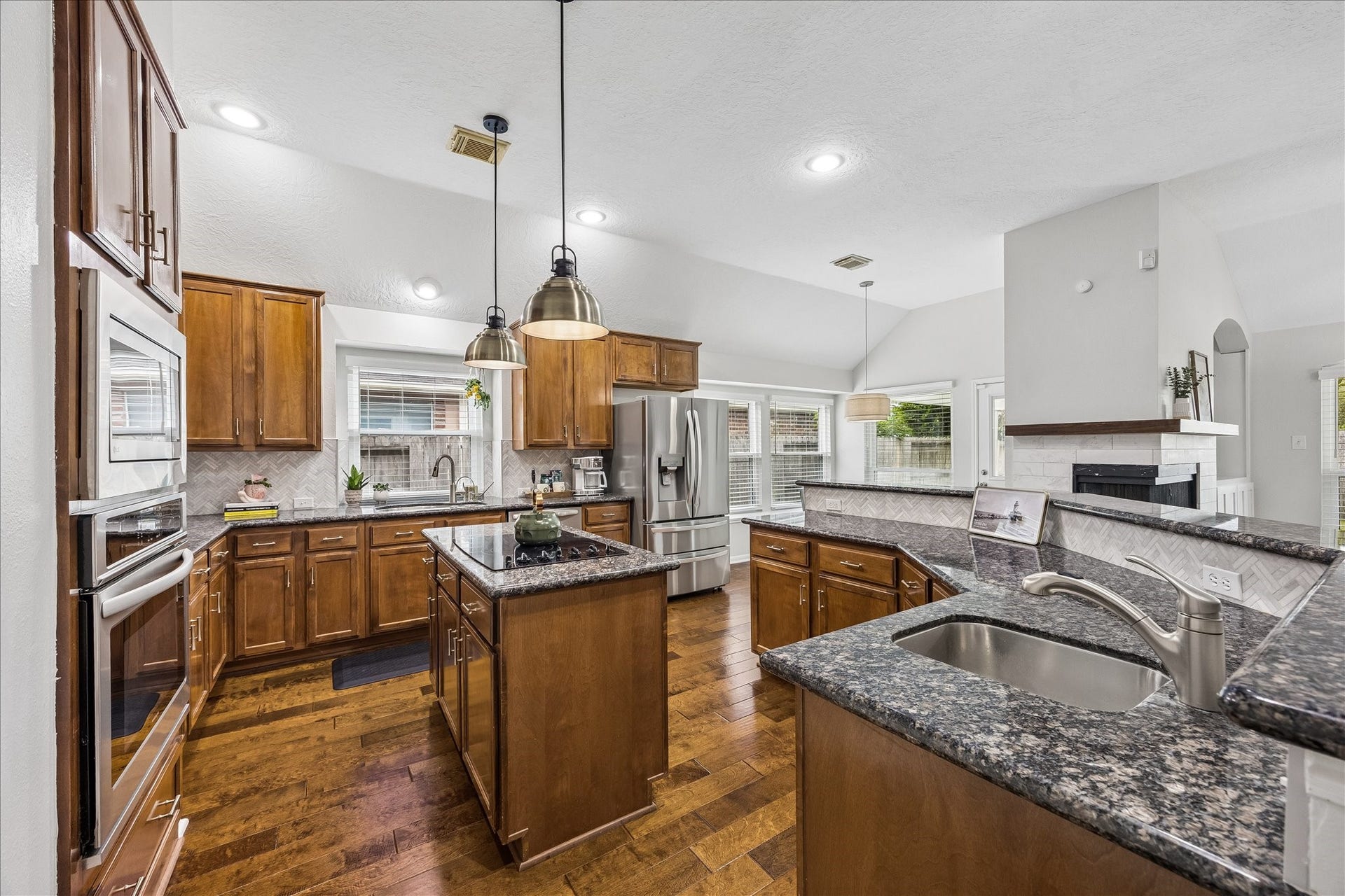 4114 Stonehurst Drive, Pearland, TX 77584 Where style meets functionality! Thoughtfully refreshed in 2024, this inviting kitchen features upgraded tile backsplash, stylish hardware, new appliances, and recessed lighting. Beautiful finishes and thoughtful improvements make this space a pleasure to cook and gather in!