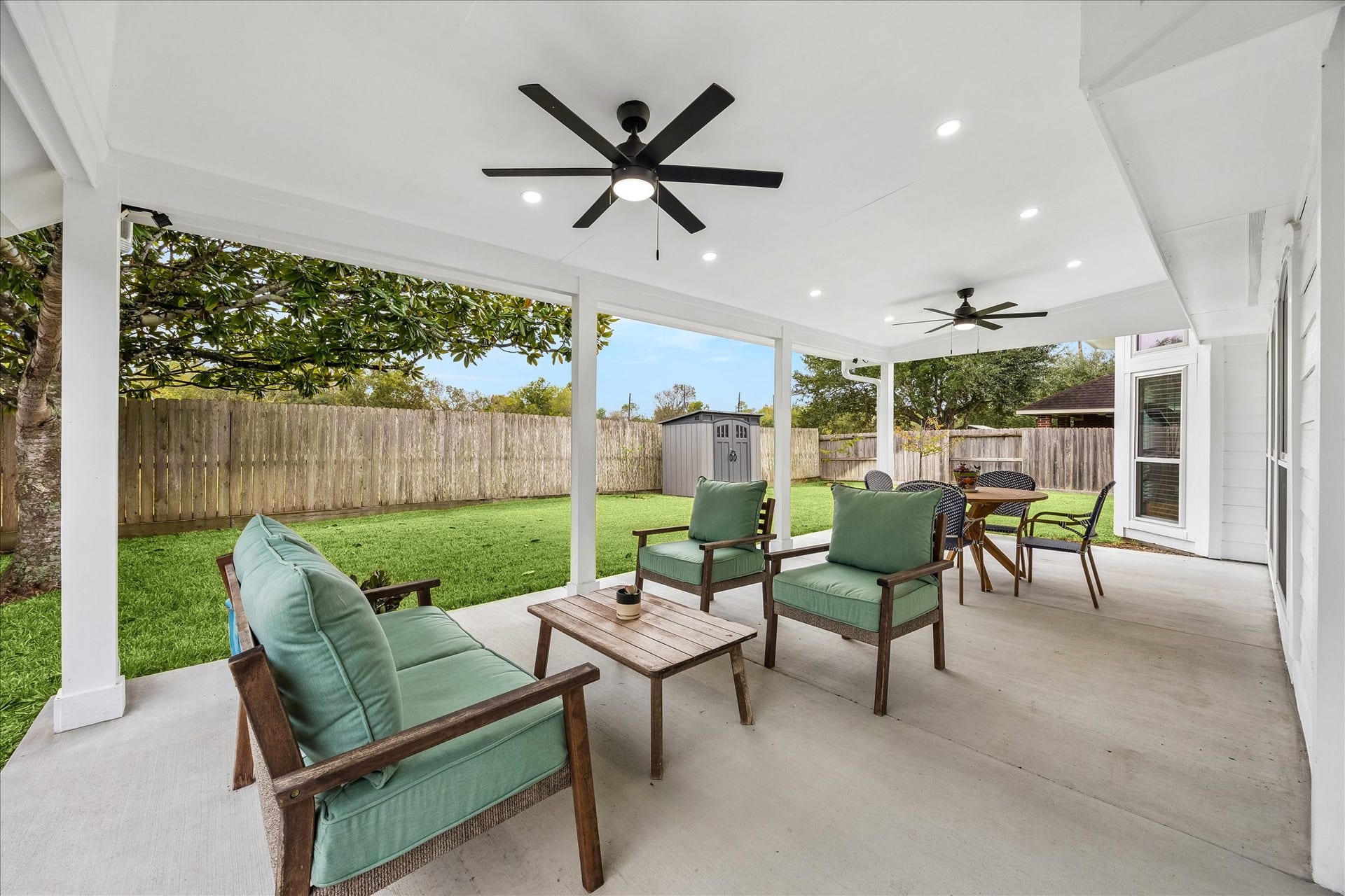 4114 Stonehurst Drive, Pearland, TX 77584 Outdoor living at its finest! This incredible extended covered patio features ceiling fans, recessed lighting, and upgraded electricalcreating the perfect setting for morning coffee, weekend gatherings, or relaxing evenings overlooking the beautifully landscaped backyard with no rear neighbors!