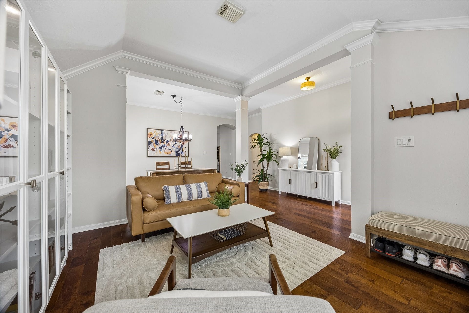 4114 Stonehurst Drive, Pearland, TX 77584 Beautifully designed for both entertaining and everyday living! This inviting space offers a versatile layout, elegant architectural detailing, and seamless flow into the adjoining dining areaperfect for gathering with family and friends.