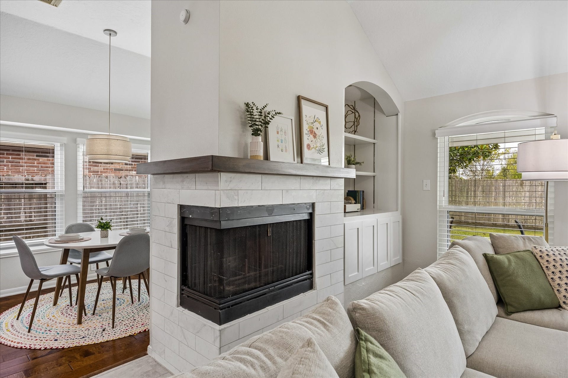 4114 Stonehurst Drive, Pearland, TX 77584 A stunning architectural focal point! Thoughtfully updated in 2024, this distinctive fireplace features a unique wraparound design that adds character and warmth to the living space. A beautiful statement piece that sets this home apart!