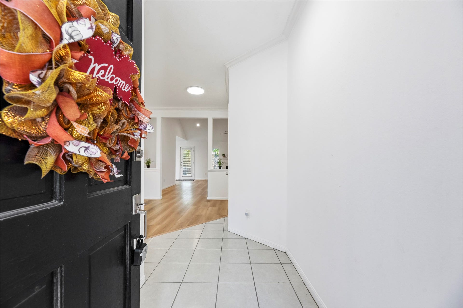 Fresh bright paint, updated flooring, and upgraded light fixtures are found throughout.