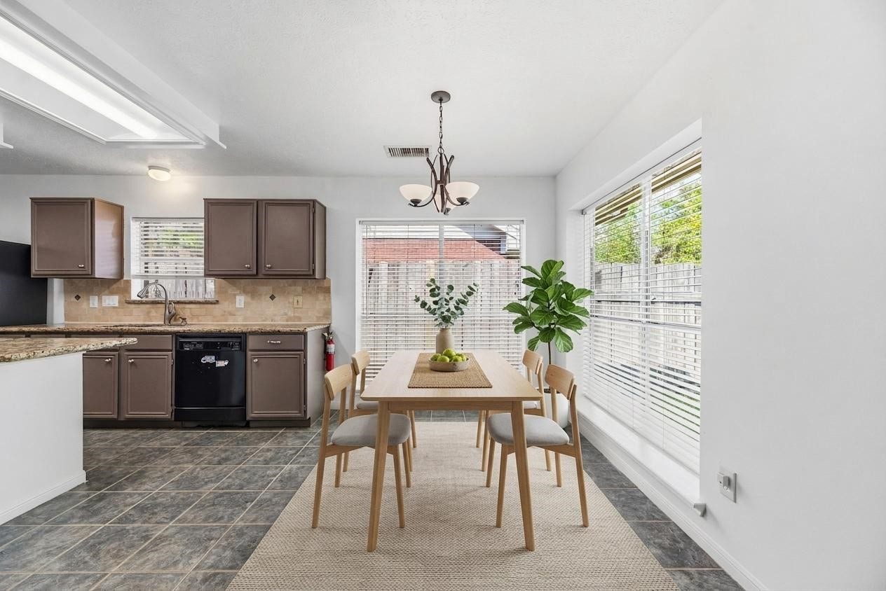 Spacious breakfast nook surrounded by windows for natural light!
