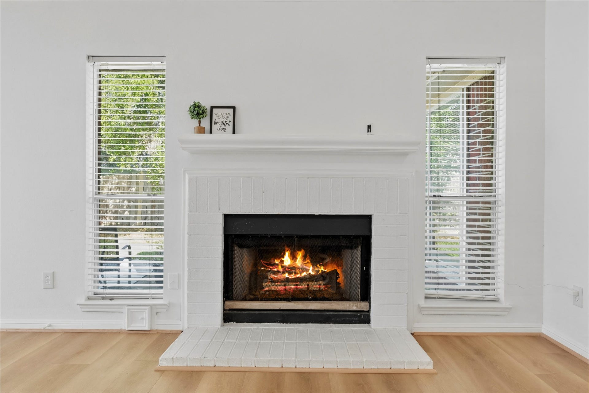 Beautiful brick fireplace with a decorative mantel
