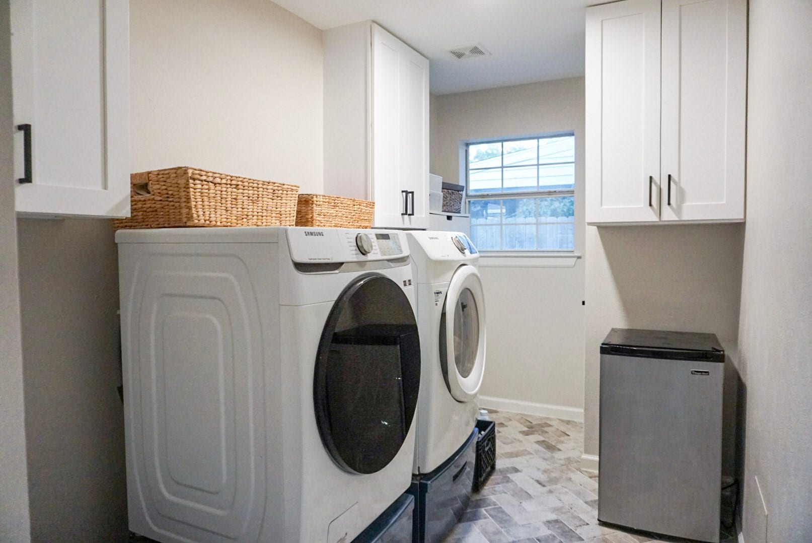 16910 Poplar Hill Street, Houston, TX 77095 Laundry/Utility Room in house, across from dining/next to back door; Built in cabinetry