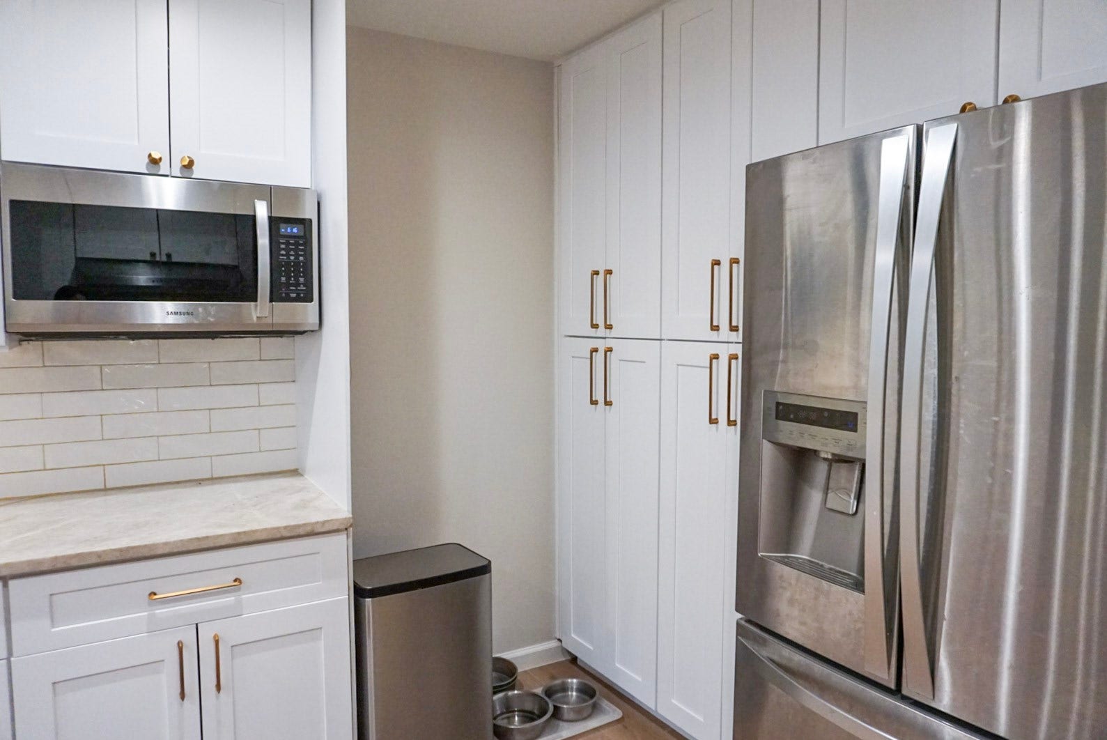 16910 Poplar Hill Street, Houston, TX 77095 Thoughtful nook design at end of kitchen in front of pantry for garbage, recycle, and pet bowls