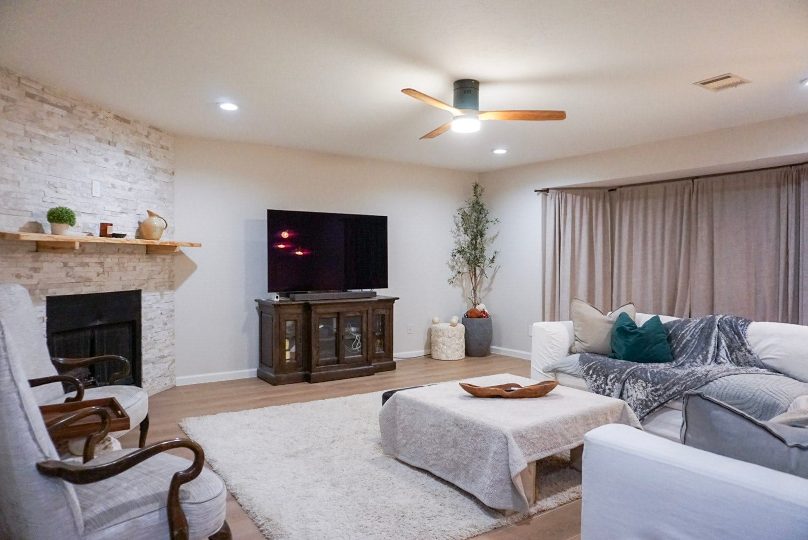 16910 Poplar Hill Street, Houston, TX 77095 Living room with beautiful stone gas fireplace, ceiling fan, LED lights (with dimmed setting accessible)