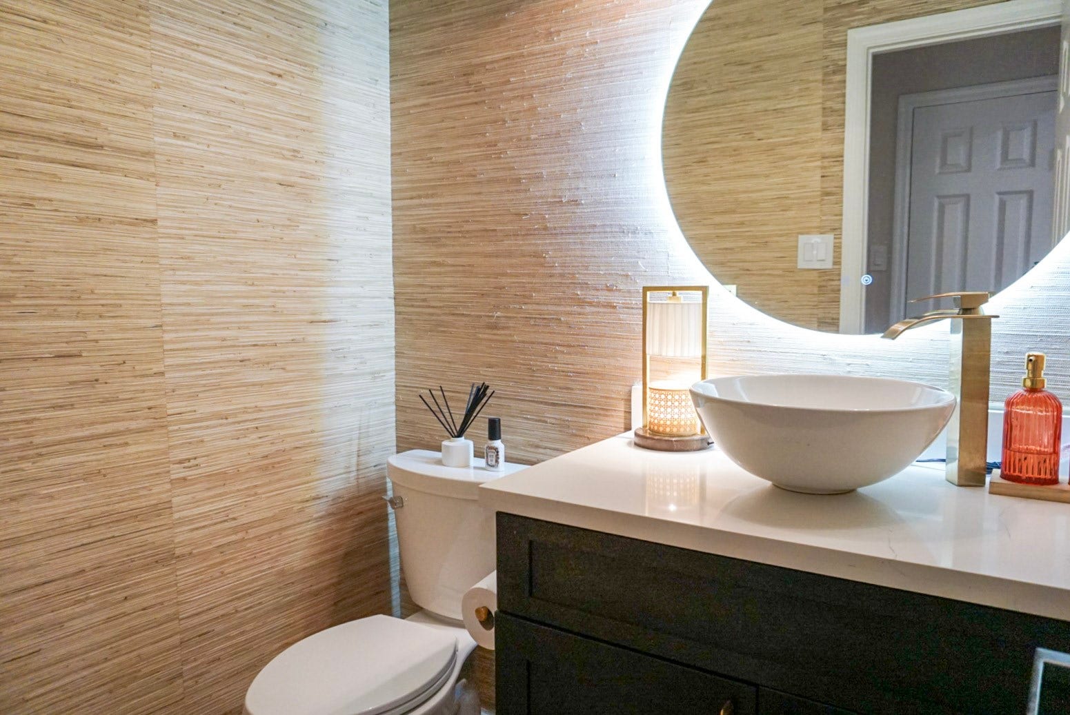 16910 Poplar Hill Street, Houston, TX 77095 Half bathroom downstairs with grasscloth wallpaper, LED mirror, design-forward updates