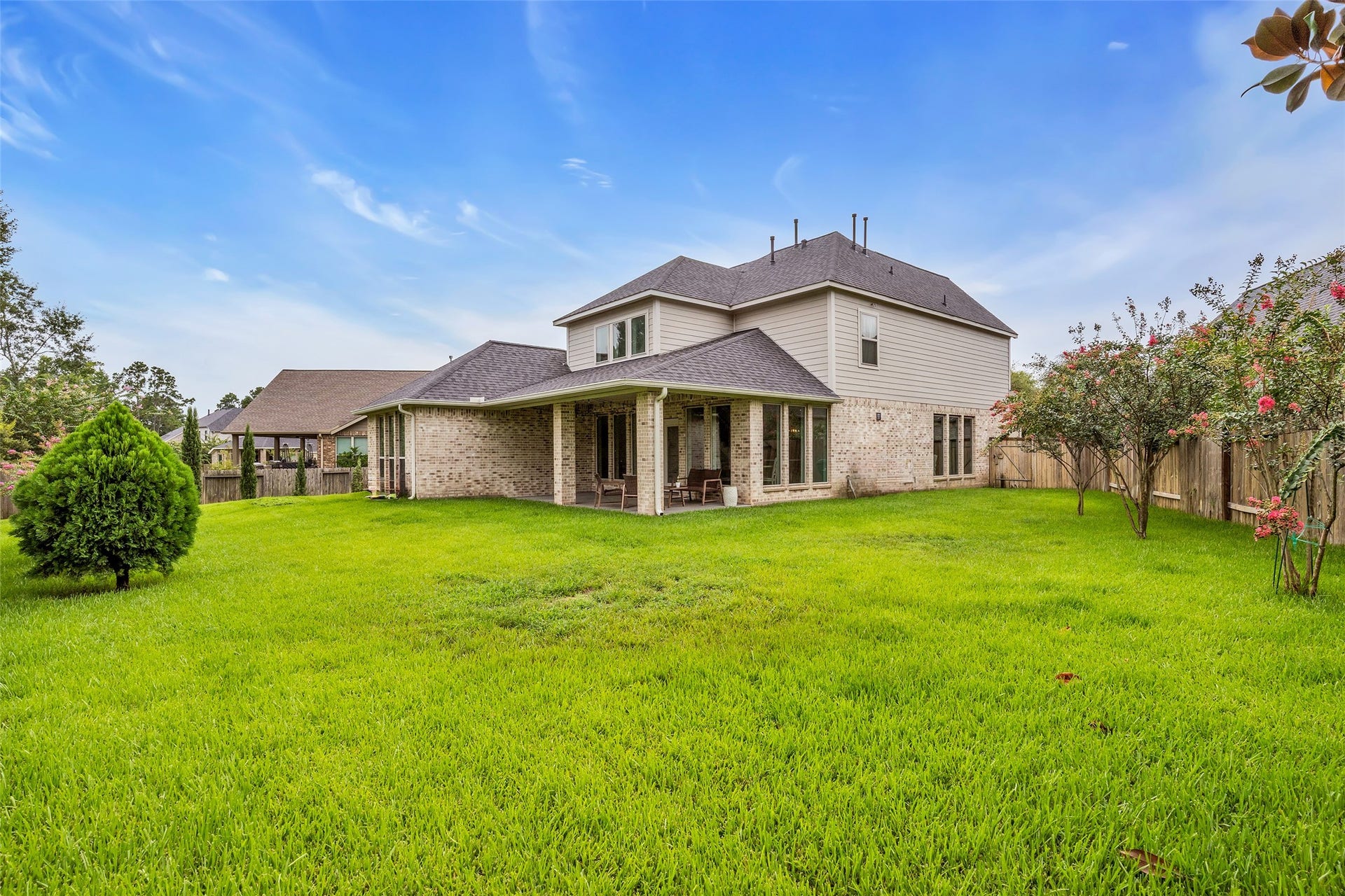Relax on the spacious covered back patio overlooking your oversized cul de sac lot