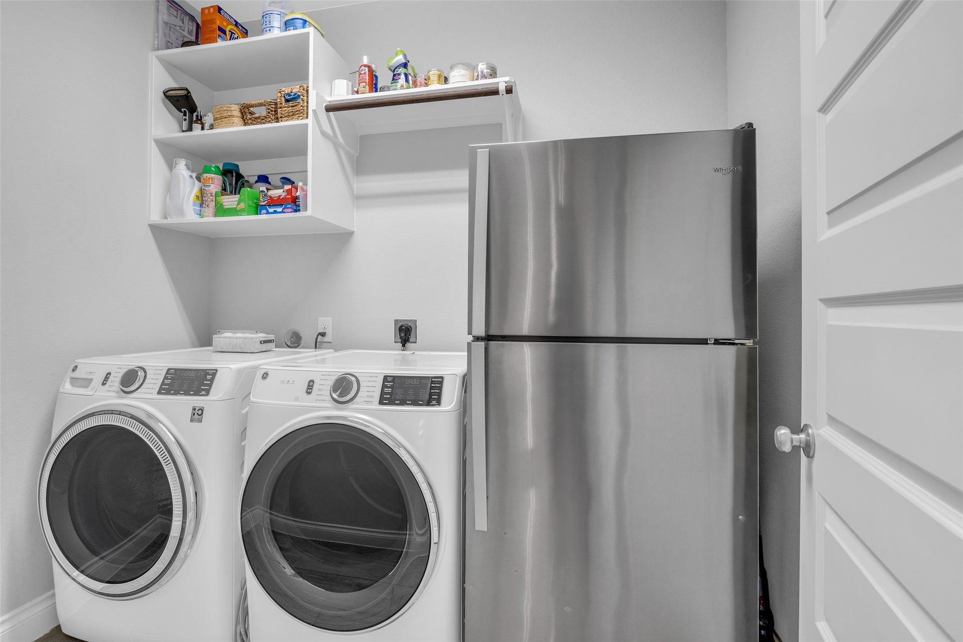 Downstairs laundry has extra room for a full size fridge