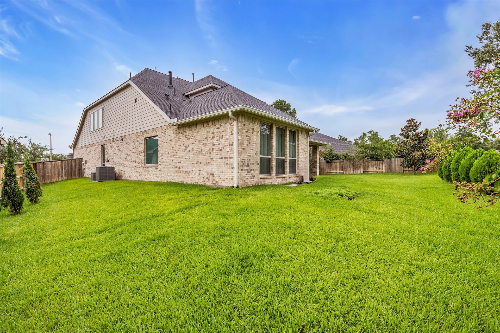 Relax on the spacious covered back patio overlooking your oversized cul de sac lot