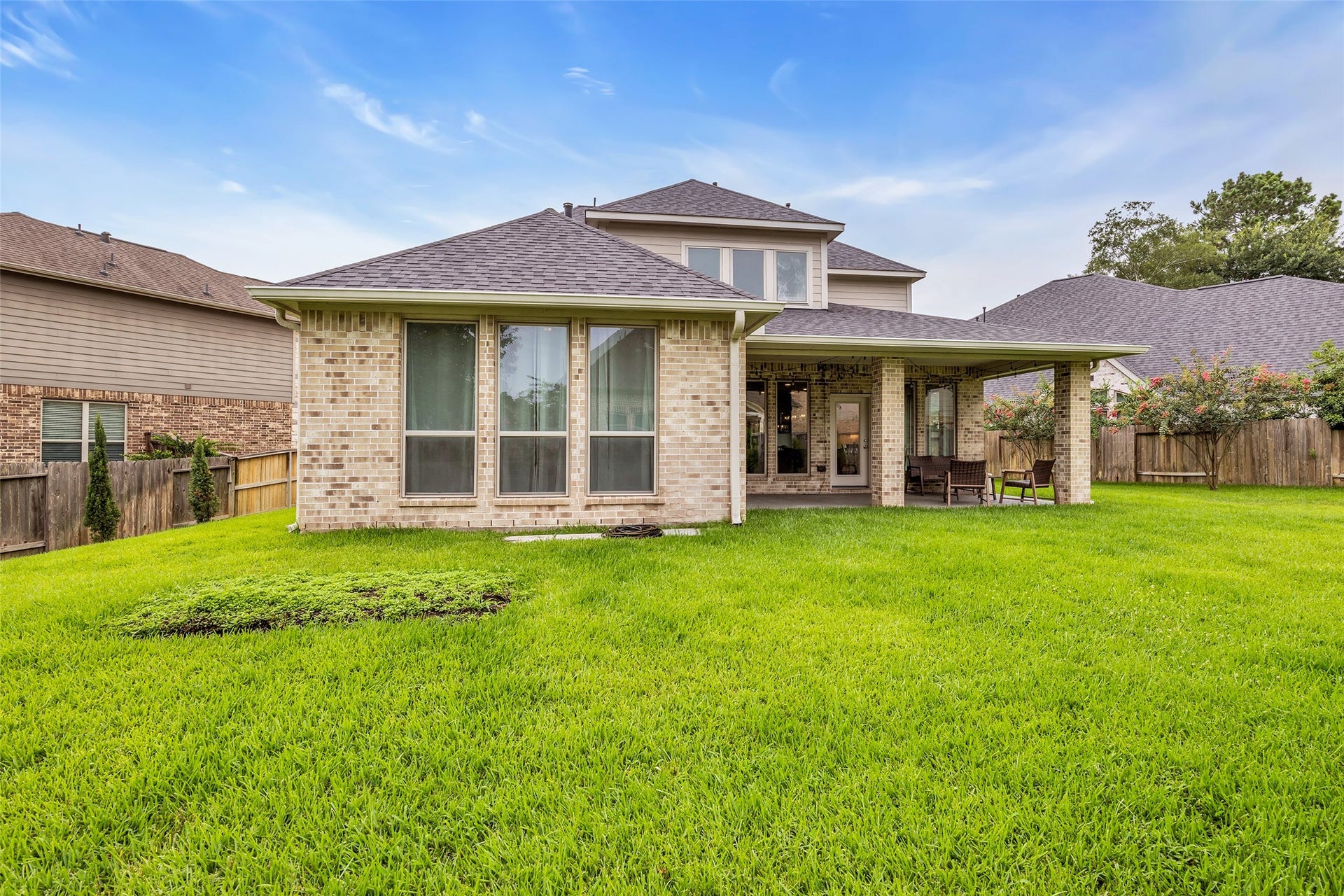 Relax on the spacious covered back patio overlooking your oversized cul de sac lot