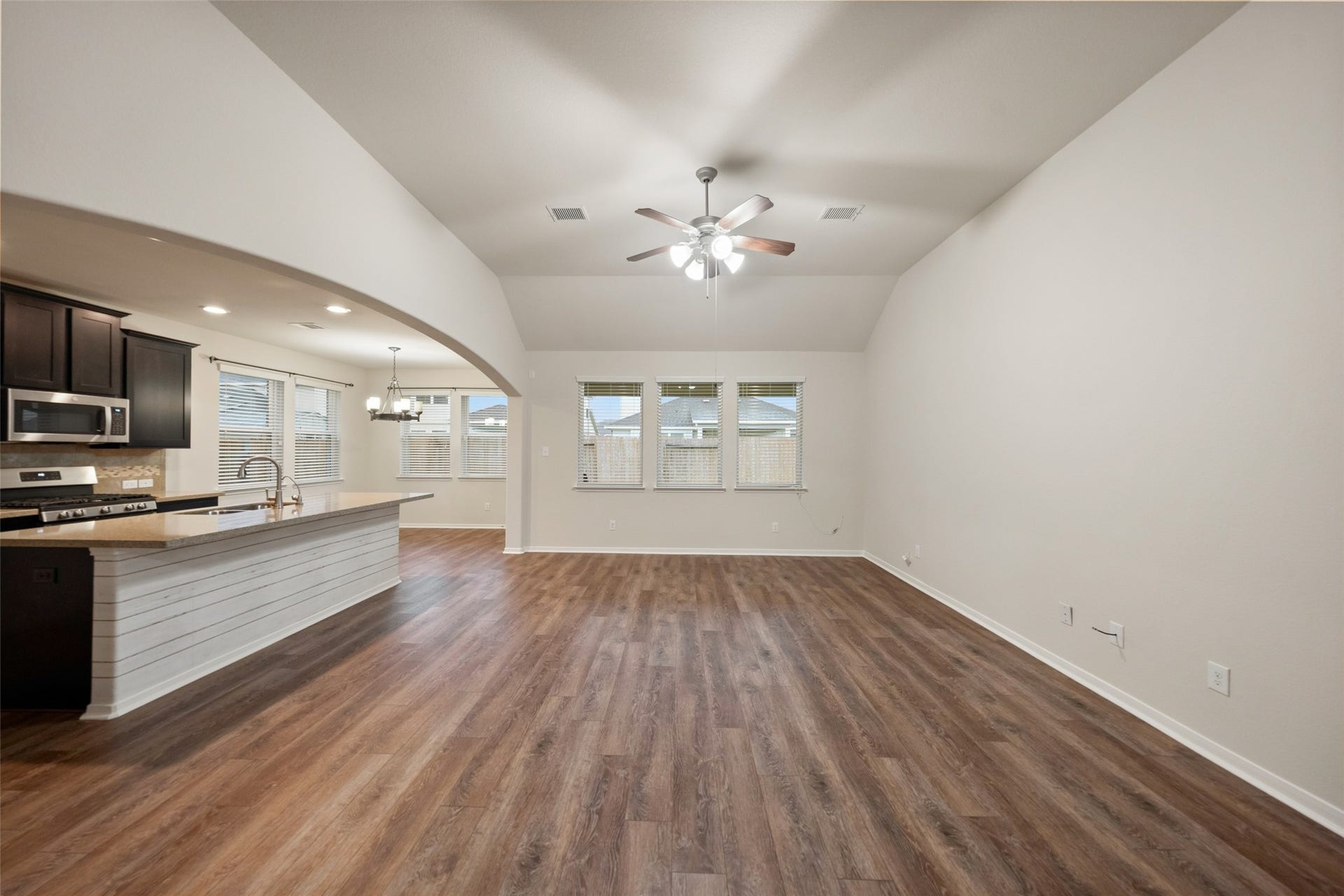 5182 Echo Falls Drive, Alvin, TX 77511 The open concept between the living, kitchen and dining areas is perfect for entertaining.