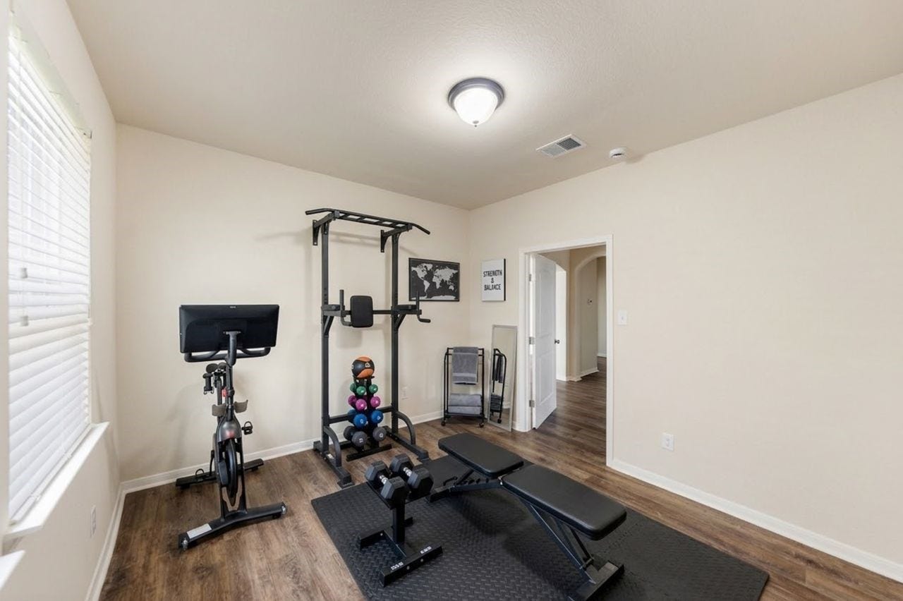 5182 Echo Falls Drive, Alvin, TX 77511 Flex Room offers vinyl wood floors and can be the perfect home gym